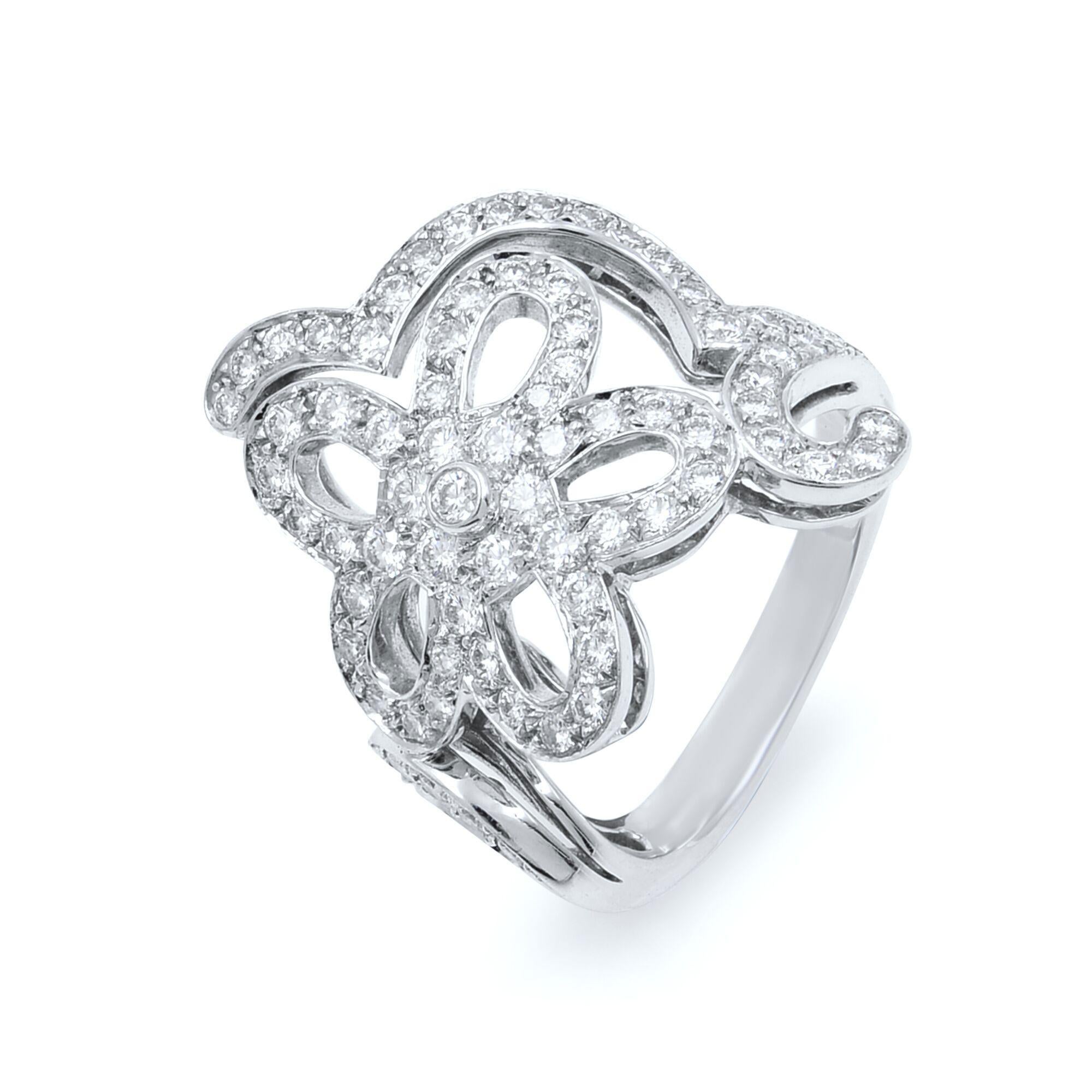 This beautiful Van Cleef & Arpels diamond floral ring is very rare and is now collectible item. Guarantee authentic in excellent pre-owned, condition recently polished and ready to wear. This piece is set with approximately 1.56cttw of round cut