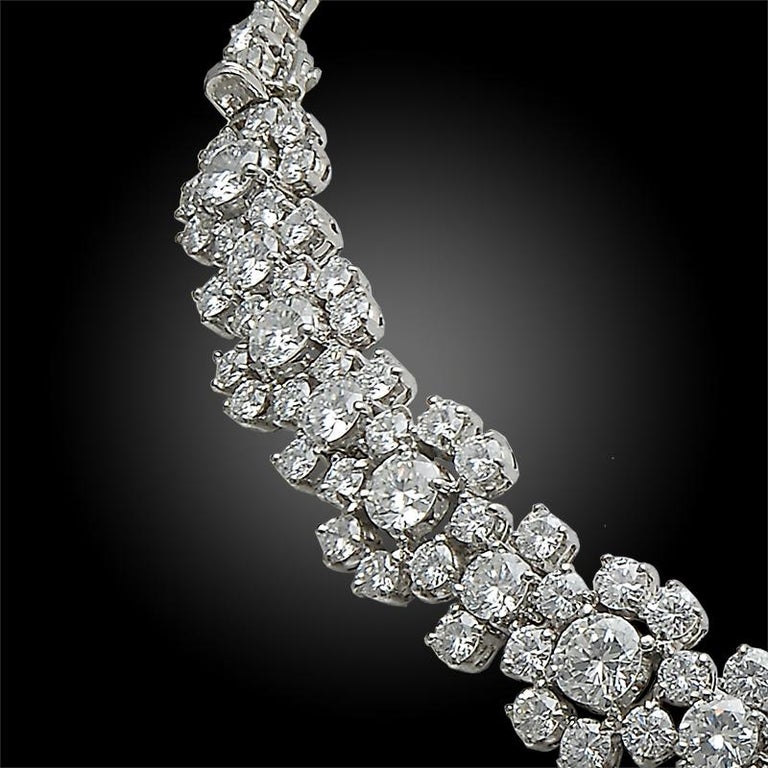 

Van Cleef & Arpels Vintage Collection Diamond Flower Convertible Necklace

VAN CLEEF & ARPELS Diamond Platinum Flower Convertible Necklace 

A classic collar necklace that converts into two bracelets by Van Cleef & Arpels. The chain is