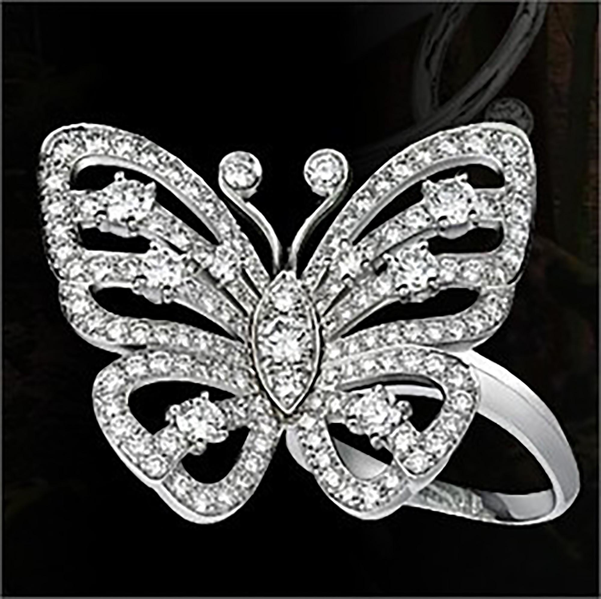 18k White Gold Diamond Flying Butterfly Between Finger Ring by Van Cleef & Arpels.  
With 131 Round brilliant cut diamonds VVS1 clarity, E color total weight approx. 3.11ct
This ring comes with Van Cleef & Arpels box.
Retail Price: $42,200 plus