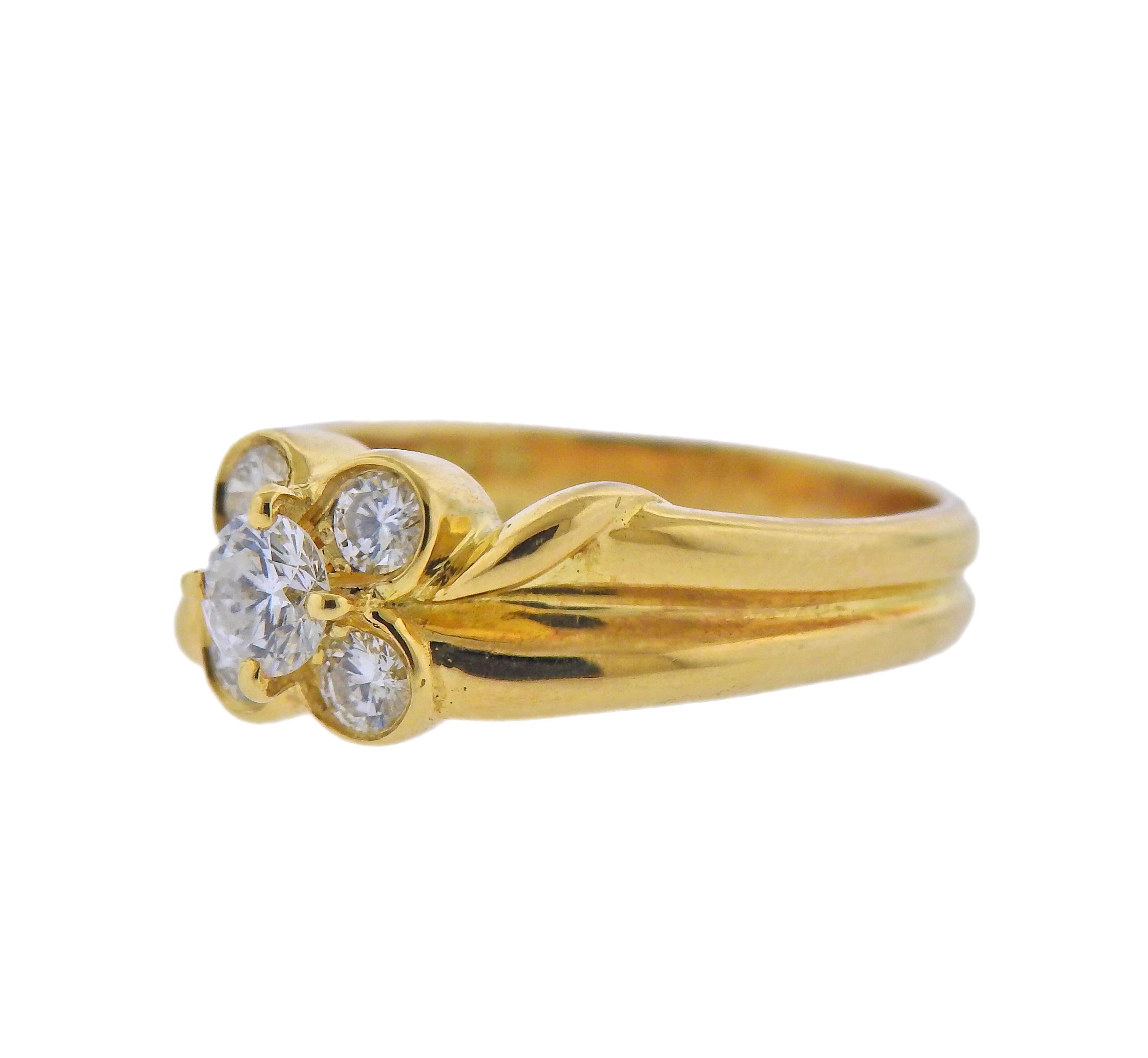 18k yellow gold flower ring by Van Cleef & Arpels with approx. 0.55ctw in diamonds. Ring size - 4.5, ring top - 7.3mm wide. Marked: VCA, 18kts, E 5907, A213. Weight - 4.7 grams.
