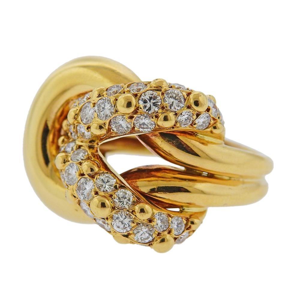 18k yellow gold ring by Van Cleef & Arpels. Ring is size 6.5, ring top is 20mm x 25mm. Set with approx. 1.70ctw in diamonds. Marked:  18Kt, 12014, 1ct70, 79, 750, Van Cleef & Arpels. Weight - 14.4 grams.R-03081