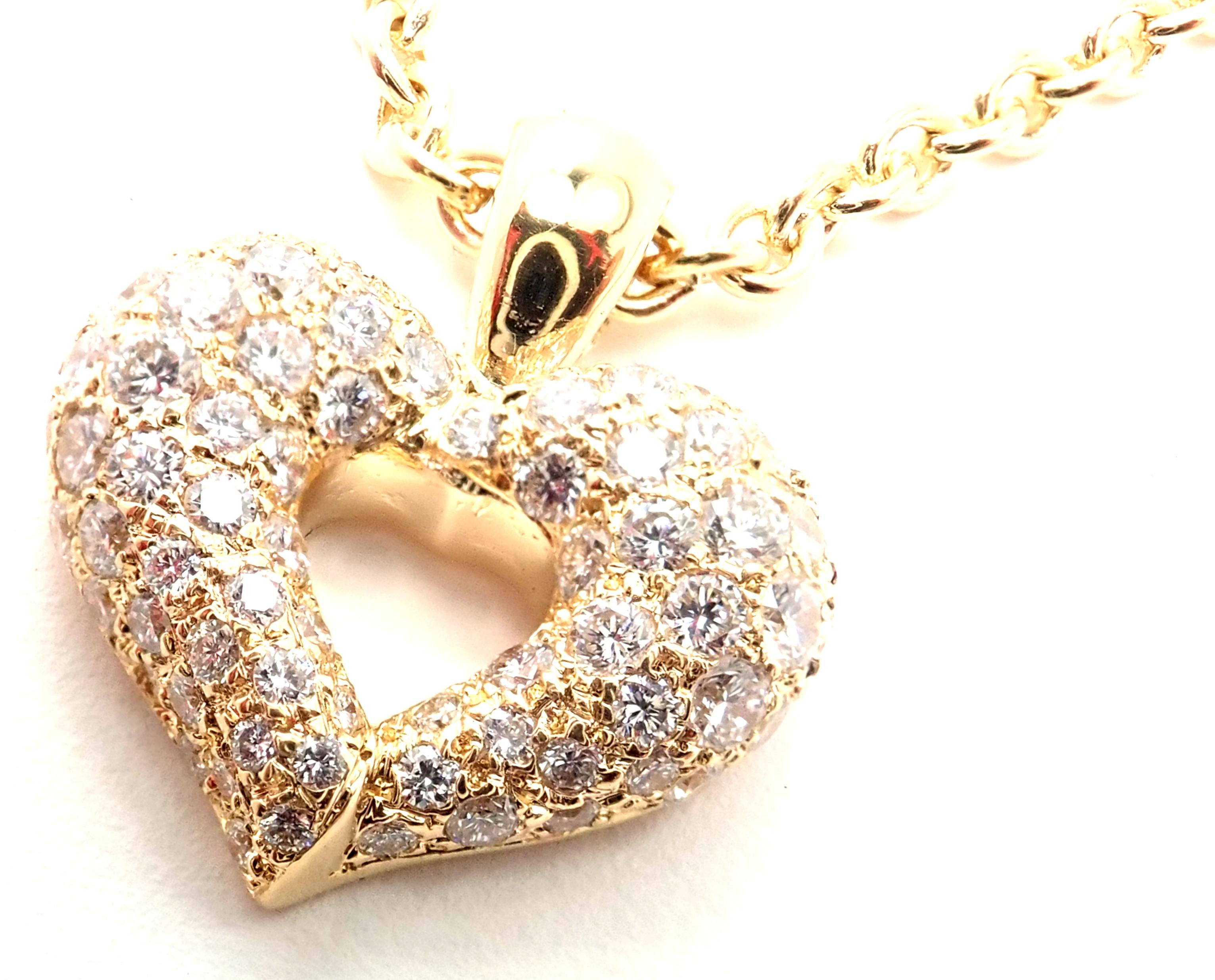18k Yellow Gold Diamond Heart Pendant Necklace by Van Cleef & Arpels.
With 80 round brilliant cut diamonds VVS1 clarity, G color total weight 2ct 
This necklace comes with service paper from a VCA store.​
Details:
Length: 16''
Pendant: 19mm