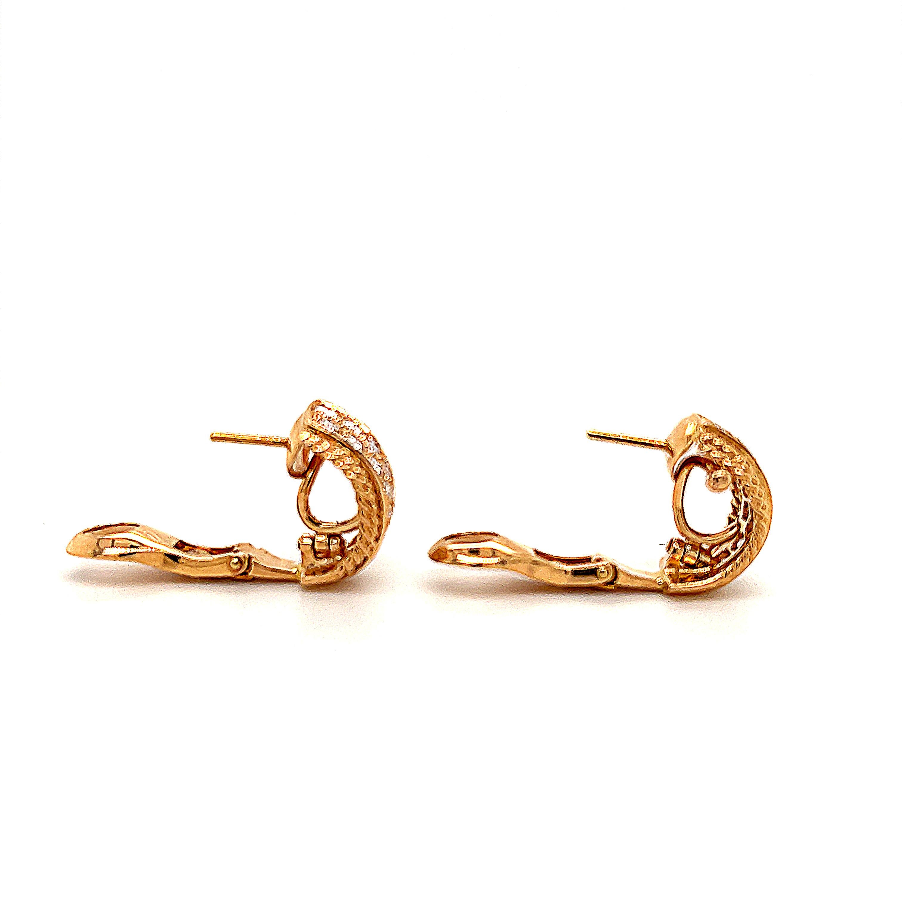 Elegant pair of earrings crafted in 18k yellow gold. This decadent pair of earrings is crafted by famed jewelry house Van Cleef & Arpels. Details are endless as the front half of the earrings are set with round brilliant cut diamonds that graduate