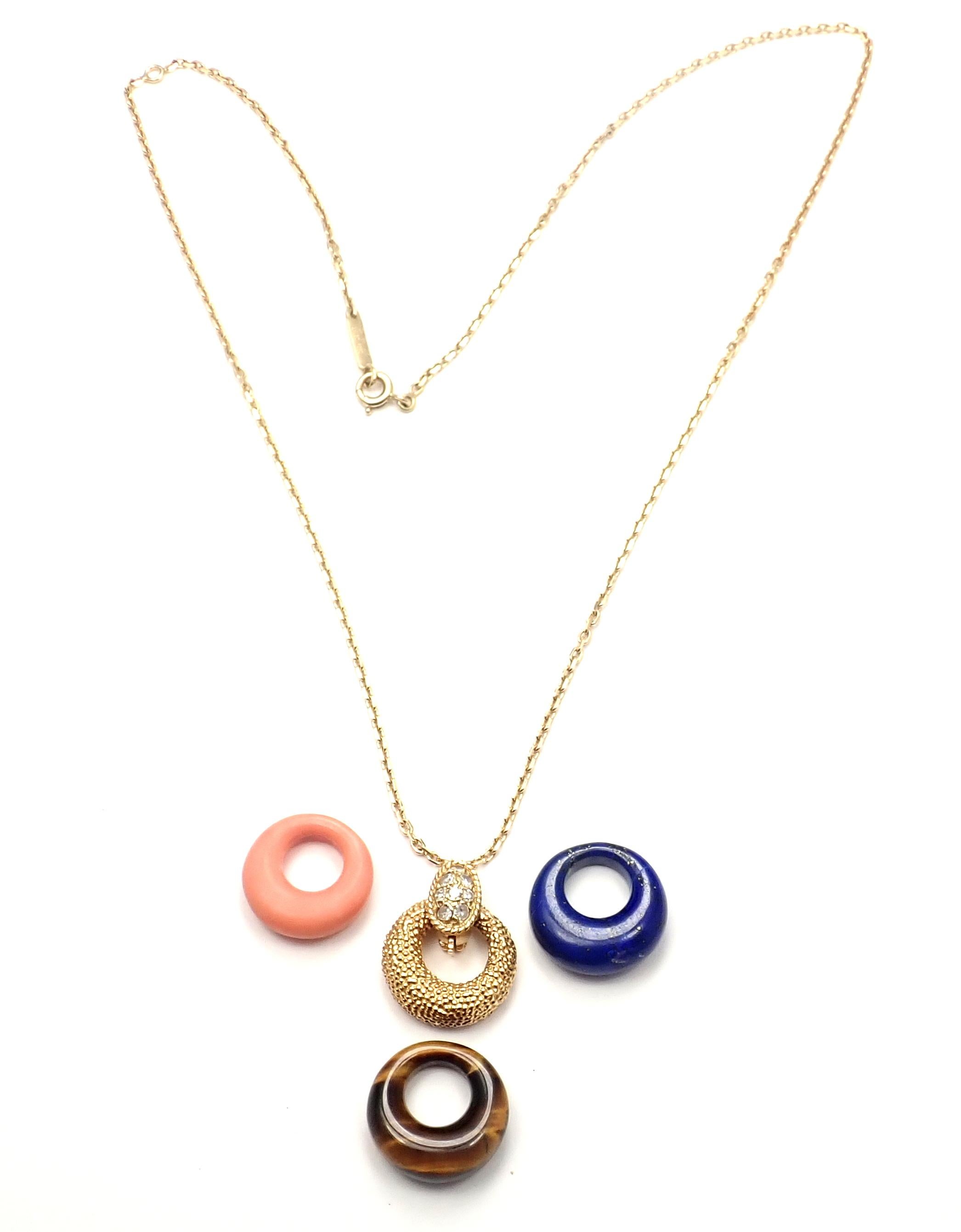 18k Yellow Gold Diamond Lapis Lazuli Coral 4 Pendants Necklace by Van Cleef & Arpels
This necklace comes with 4 interchangeable pendants.
With 8 round brilliant cut diamonds total weight approx. .22ct
1 coral, 1 lapis, 1 tiger