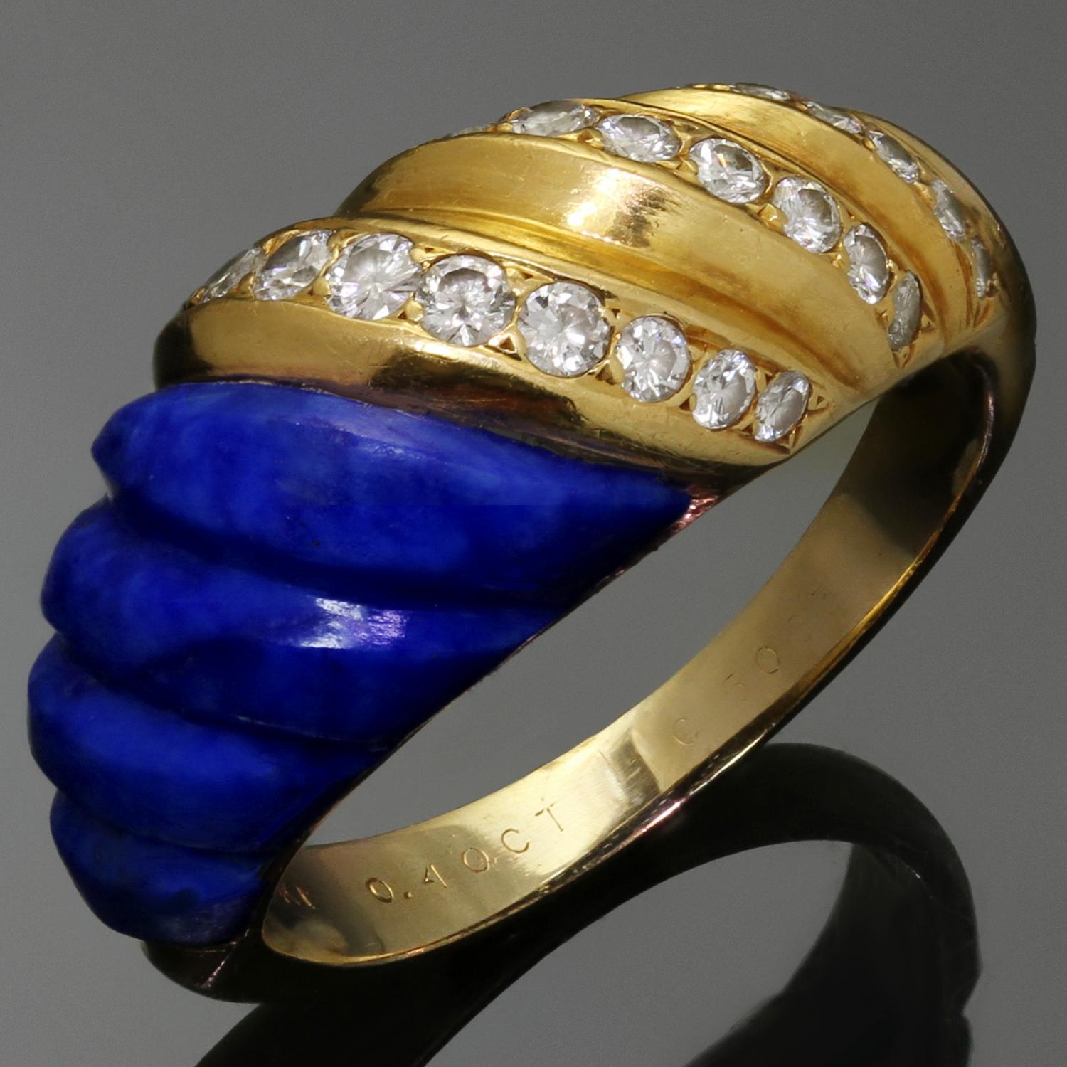 This stunning vintage Van Cleef & Arpels ring features a fluted design crafted in 18k yellow gold and set with fluted lapiz lazuli and round brilliant-cut F-G-H VS1-VS2 diamonds weighing an estimated 0.40 carats in 18k yellow gold. Made in France