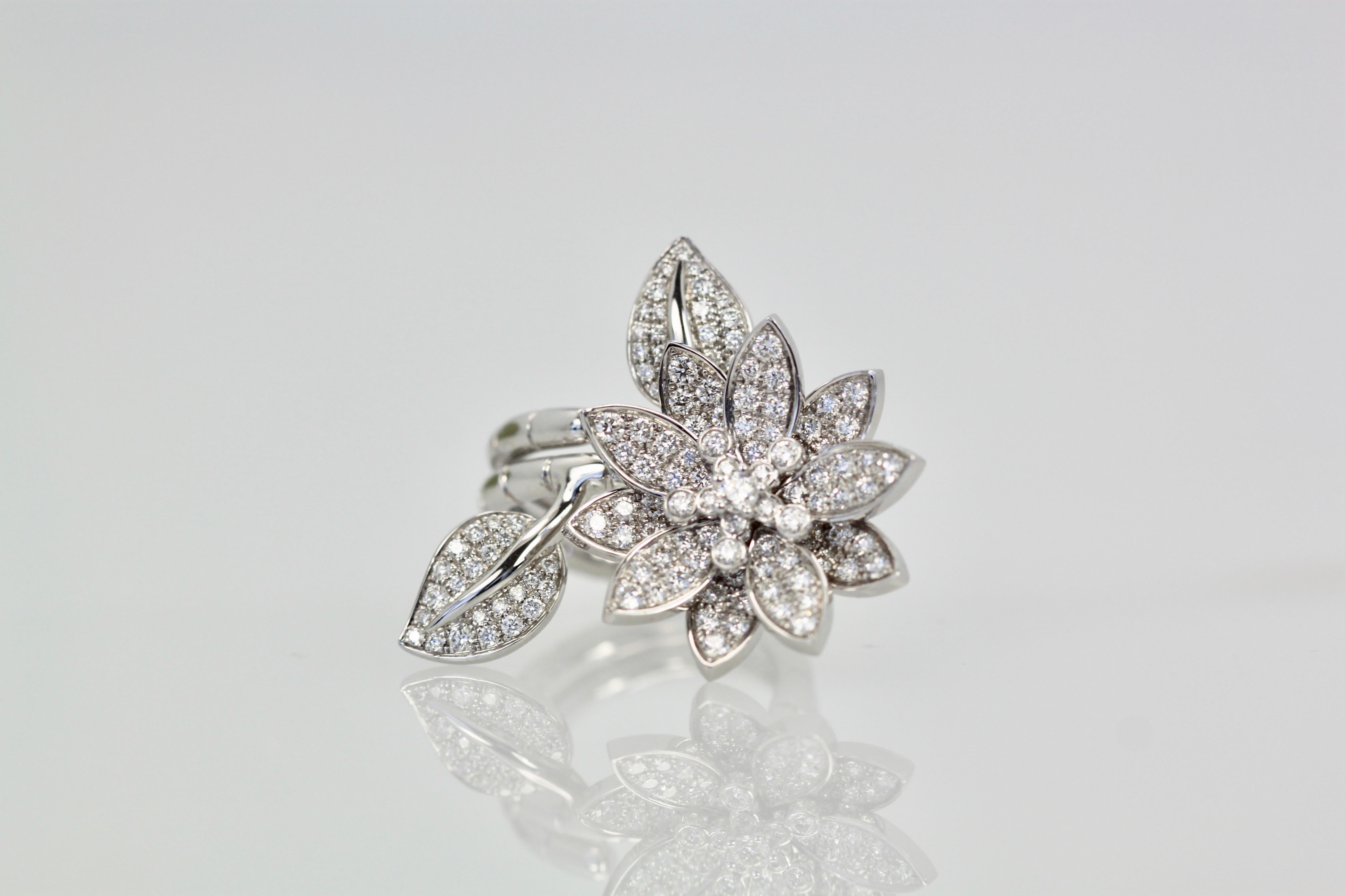 I just love this ring from the Lotus collection by Van Cleef.  This ring can be worn on one finger or two as the ring opens up so the Lotus flower is on one finger and the leaves are on another.  This is the all Diamond version with 127 stones