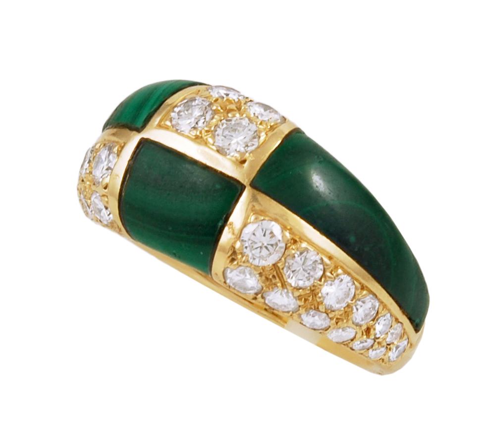 A unique piece by Van Cleef & Arpels circa 1970s, comprising a vintage 18k yellow gold ring of bombe design, featuring an alternating pattern of malachite and pave set brilliant diamonds in 18k yellow gold, signed Van Cleef & Arpels. 
Size