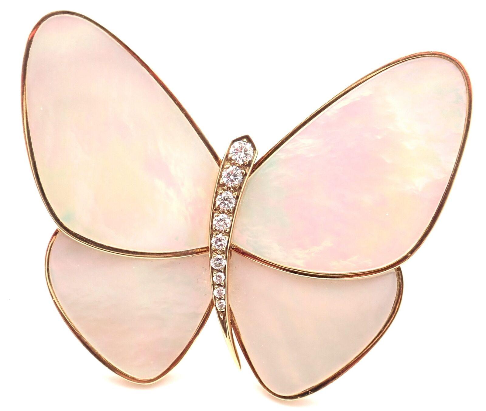 18k Yellow Gold Butterfly Diamond Mother Of Pearl Brooch Pin by Van Cleef & Arpels.
With 9 round brilliant cut diamonds VVS1 clarity, E color total weight approximately .23ct
4 Mother of pearl stones
Details: 
Weight: 19.8 grams
Measurements: 42mm x