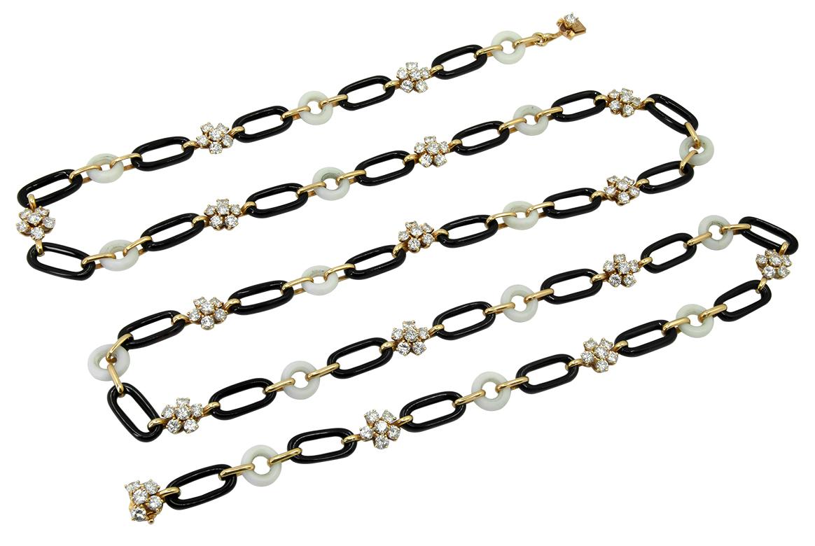 VAN CLEEF & ARPELS Diamond, Onyx, and Coral Necklace
An 18k yellow gold link necklace, set with round brilliant-cut diamonds, onyx, and white coral signed by Van Cleef & Arpels.
Measures approx. 37.5″ in length by 0.37″ in width
Stamped “VCA” and