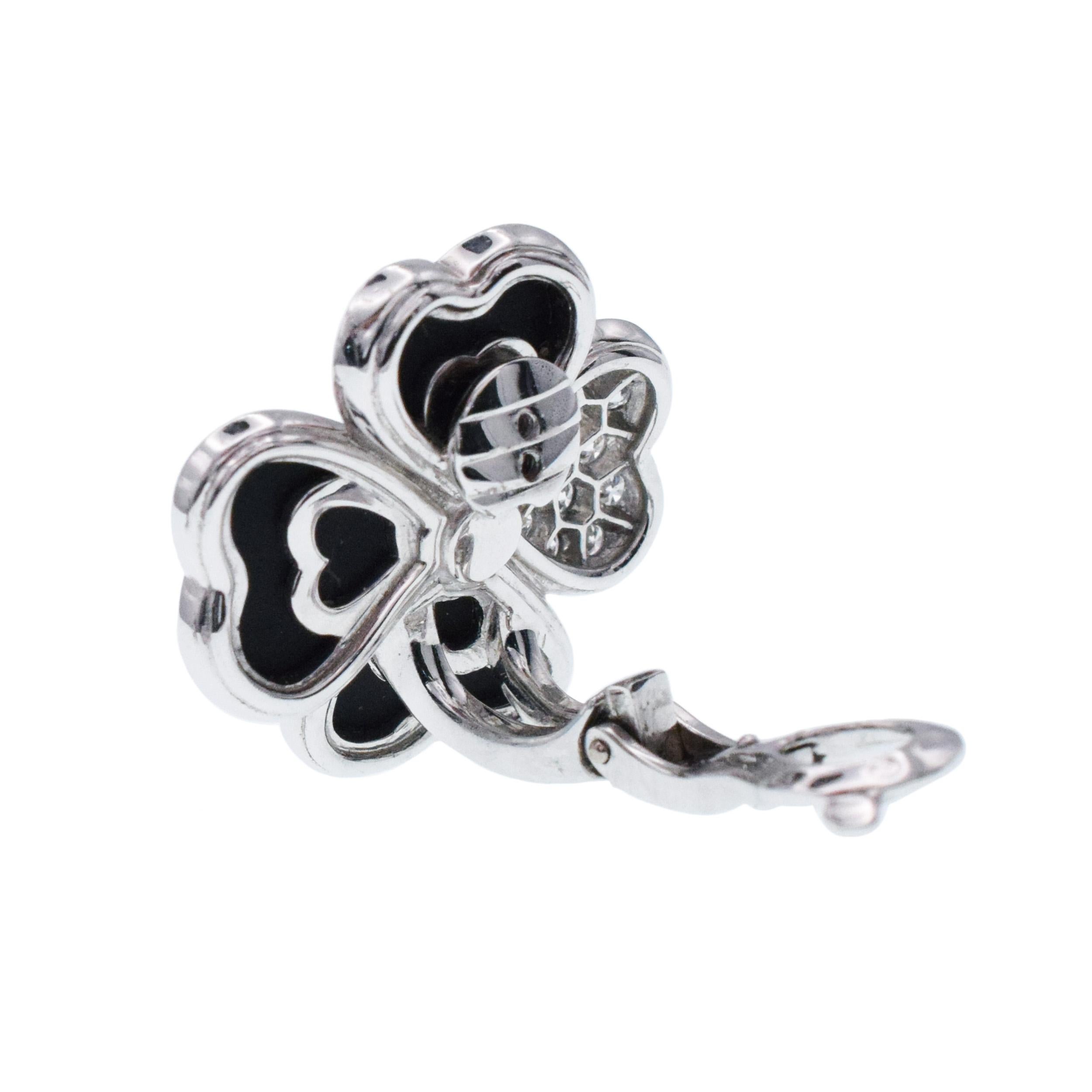 Van Cleef & Arpels Diamond, Onyx, and White Gold 'Cosmos' Clip Earrings For Sale 4