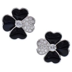 Van Cleef & Arpels - Boucles d'oreilles clips "Cosmos" en or blanc, diamant et onyx