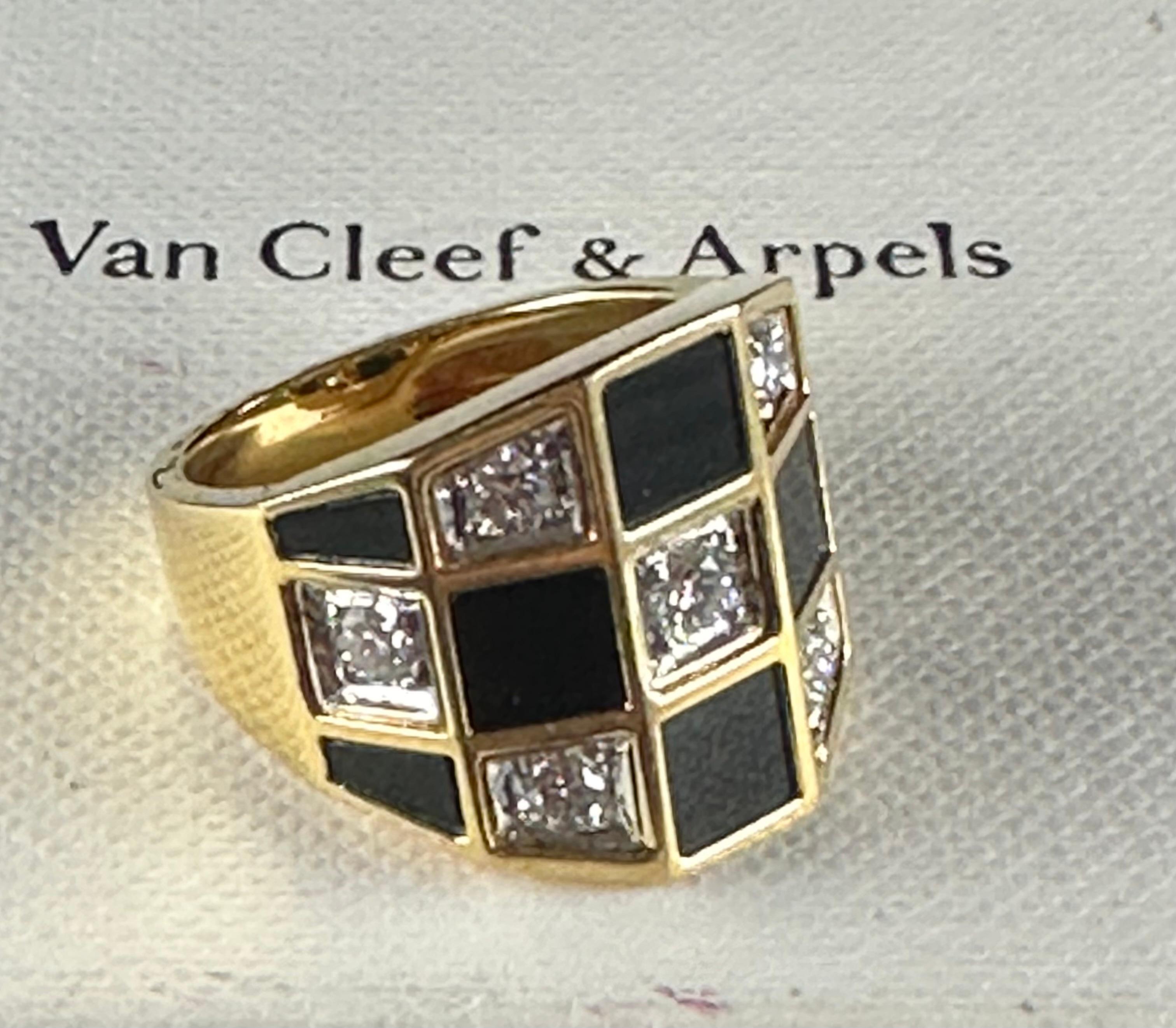 Van Cleef and Arpels circa 1960s diamond & black onyx checkerboard drawbridge shaped cocktail ring , French Hallmark size 5 and can be resized. See seven round diamond and eight black onyx inlaid depicting the ceckerboard.  Immerse yourself in the