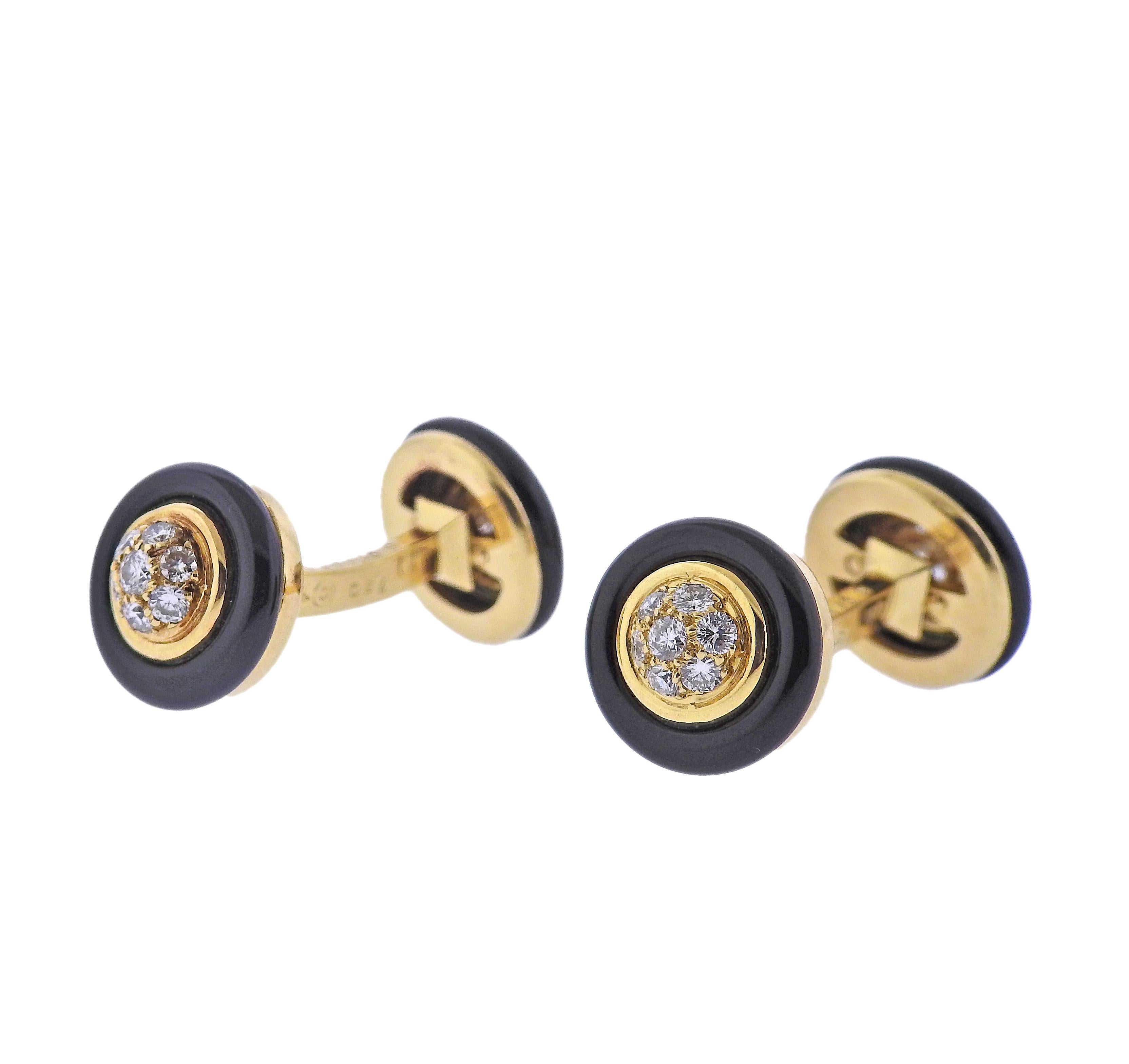 Pair of classic 18k gold Van Cleef & Arpels cufflinks, with onyx and approx. 0.64ctw F/VVS diamonds. Cufflink top is 12mm in diameter. Marked: VCA, B 9102X28, 83, French marks. Weight - 12.5 grams.