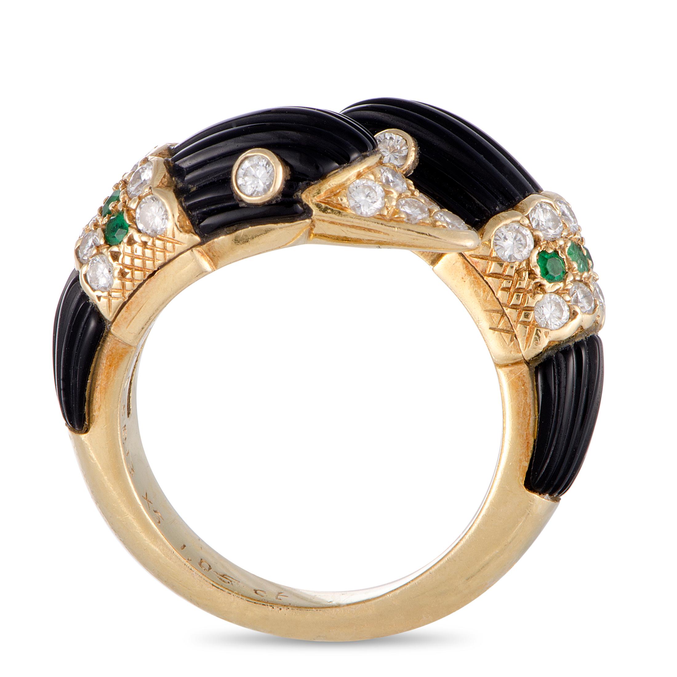 This Van Cleef & Arpels vintage ring is made out of 18K yellow gold, diamonds, emeralds, and fluted onyx. The diamonds boast grade F color and VS1 clarity and total 0.60 carats. The ring weighs 10.6 grams, featuring band thickness of 3 mm and top