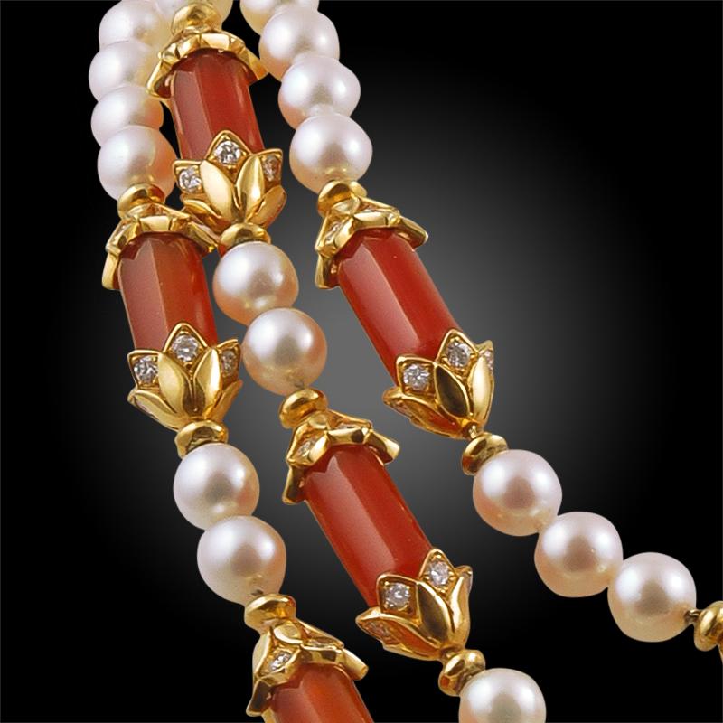 Comprised of alternating cultured pearl and diamond & gold decorated carnelian, this exquisite long necklace by Van Cleef & Arpels is comprised of 18k yellow gold and diamonds weighing approximately 10.92 carats. Van Cleef & Arpels typically chooses