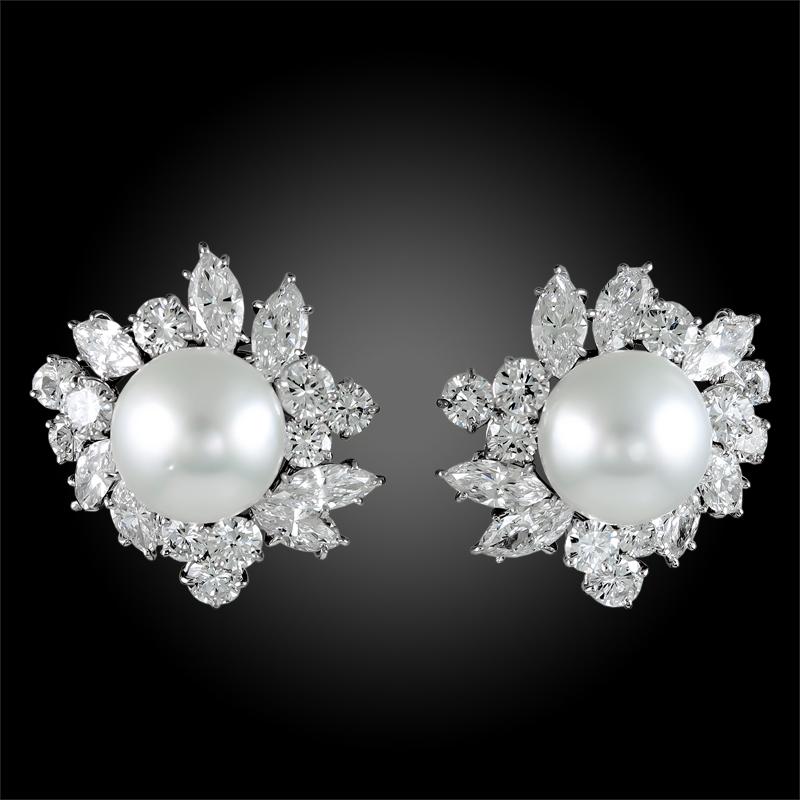 VAN CLEEF & ARPELS Pearl Diamond Cluster Earrings in Platinum.

A pair of floral-themed pearl and diamond cluster earrings by Van Cleef & Arpels. Each floret is centered with a round pearl pistil and surrounded by a halo of clustered round