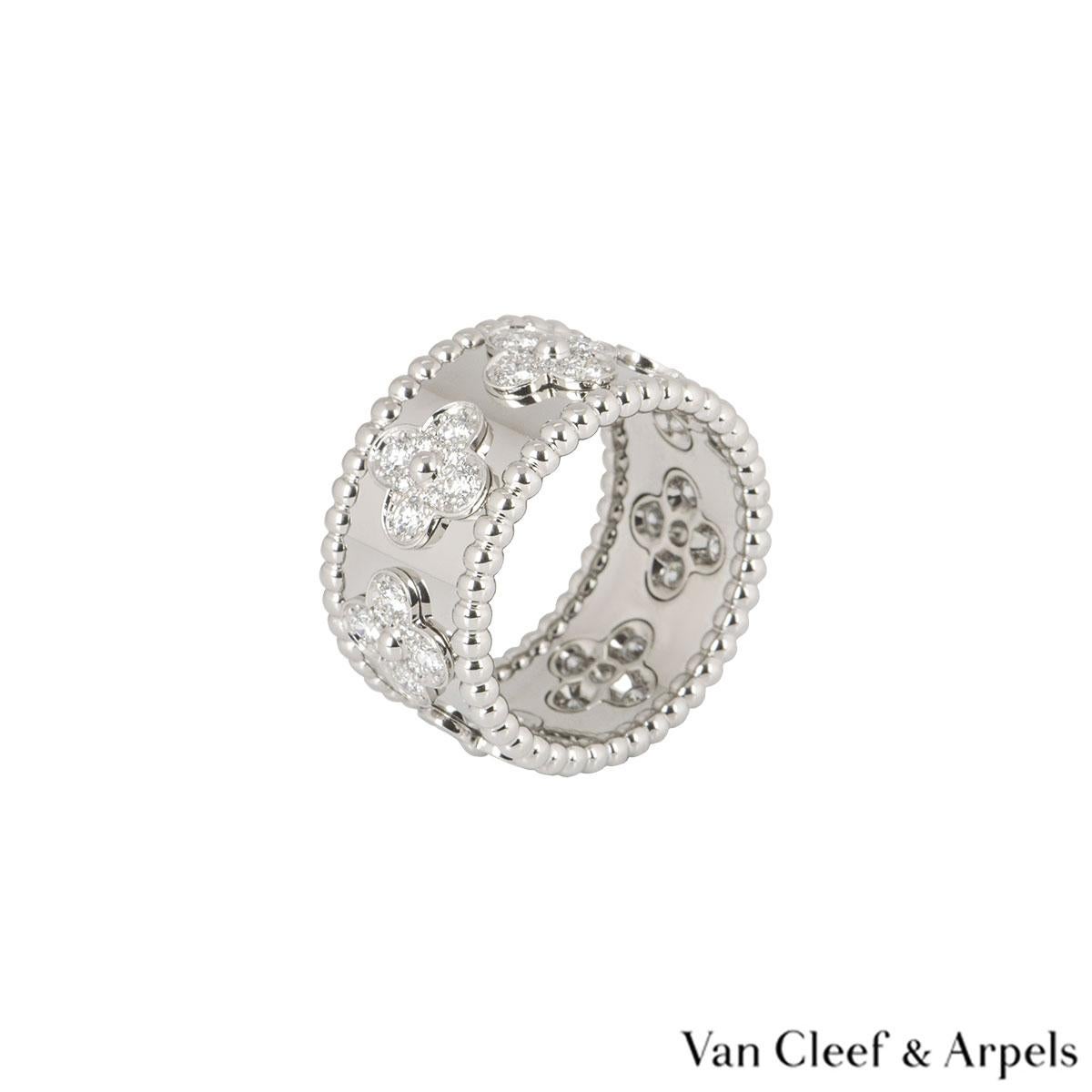 A beautiful 18k white gold ring by Van Cleef & Arpels from the Perlée Clovers collection. The ring features 7 four leaf clover motifs, each set with 8 round brilliant cut diamonds. There are a total of 56 diamonds totalling approximately 1.49ct. The