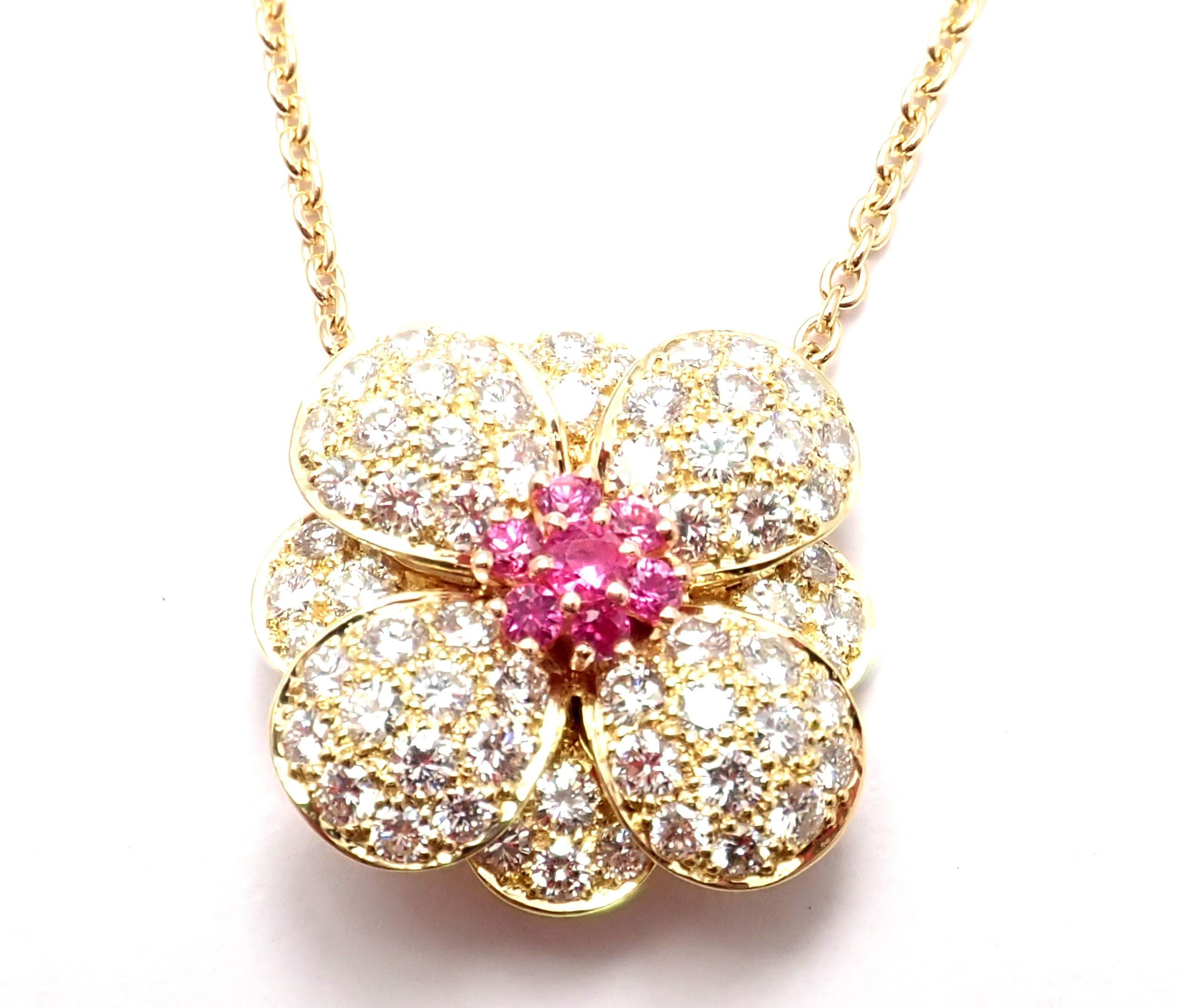 18k Yellow Gold Diamond And Pink Sapphire Flower Pendant Necklace by Van Cleef & Arpels.
With brilliant cut diamonds VVS1 clarity, E color and 7 round pink sapphires.
This necklace comes with Van Cleef & Arpels service paper.
Details:
Length: