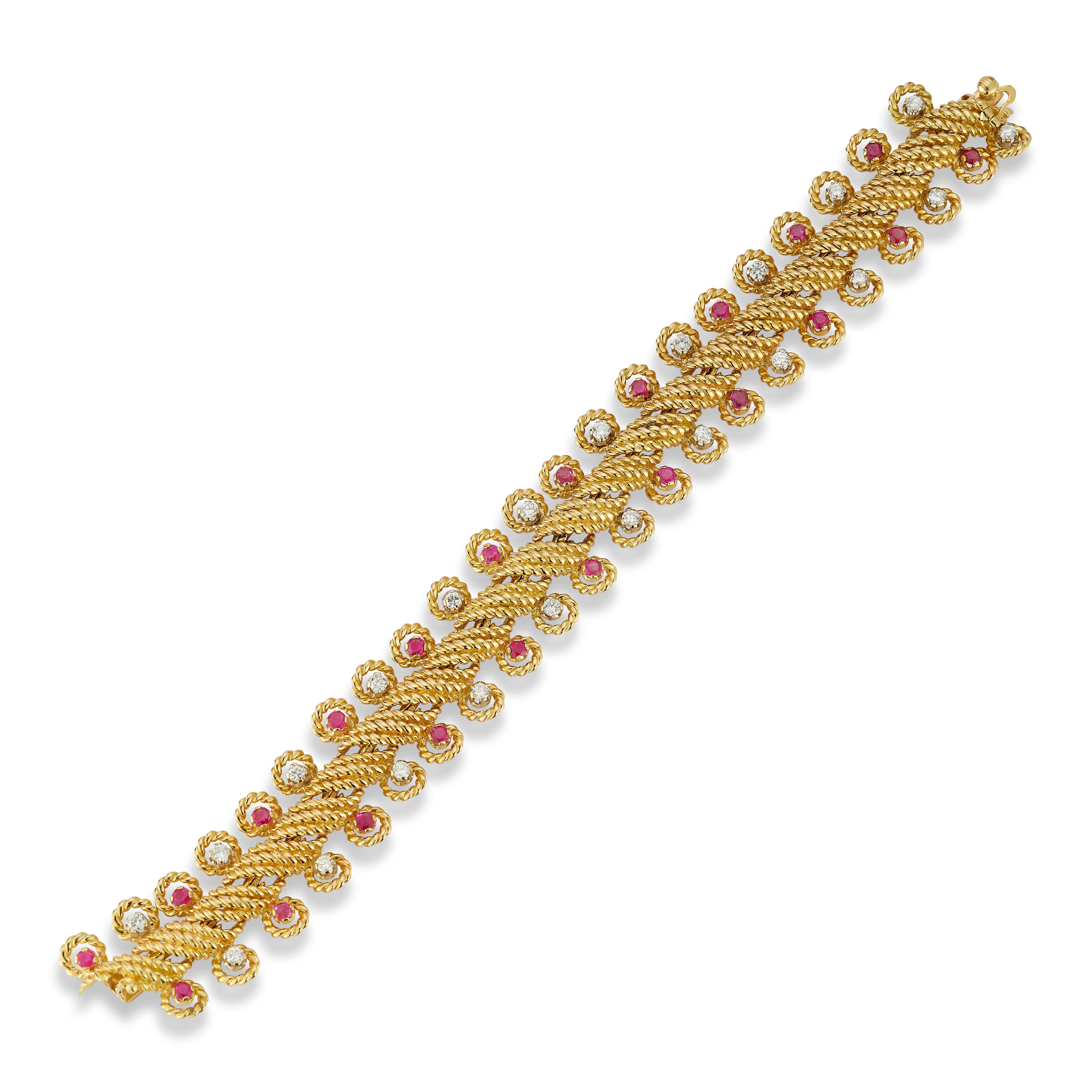Van Cleef & Arpels Diamond & Ruby Bracelet

A gold bracelet set with round cut diamonds & rubies 
Measurements: 7.5