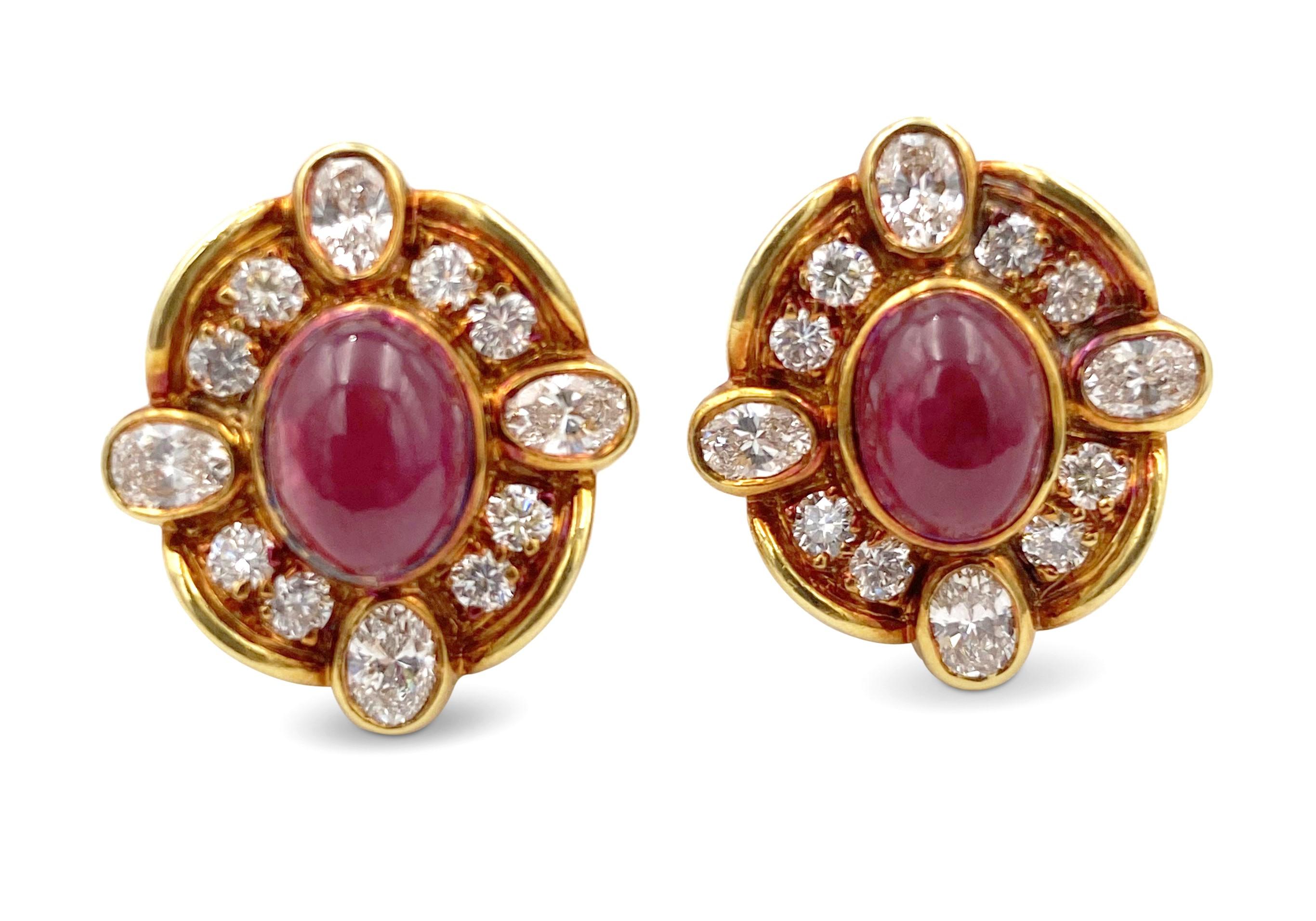 Vintage Van Cleef & Arpels diamond and ruby ear clips made in 18 karat yellow gold. The earrings center on cabochon ruby stones weighing an approximate 6.40 carat total surrounded by oval and round brilliant cut diamonds (F-G in color, VS clarity)