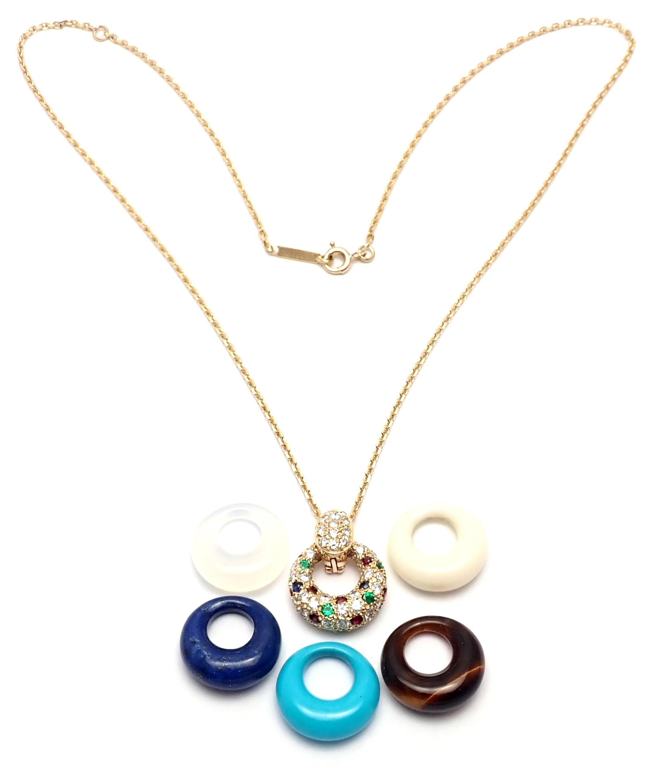 18k Yellow Gold Diamond Ruby Emerald Sapphire Lapis Turquoise Mother of Pearl Tiger Eye Rock Crystal Pendant Necklace.
This necklace comes with 6 interchangeable pendants.
With 6 round brilliant cut diamonds VVS1 clarity, E color total weight