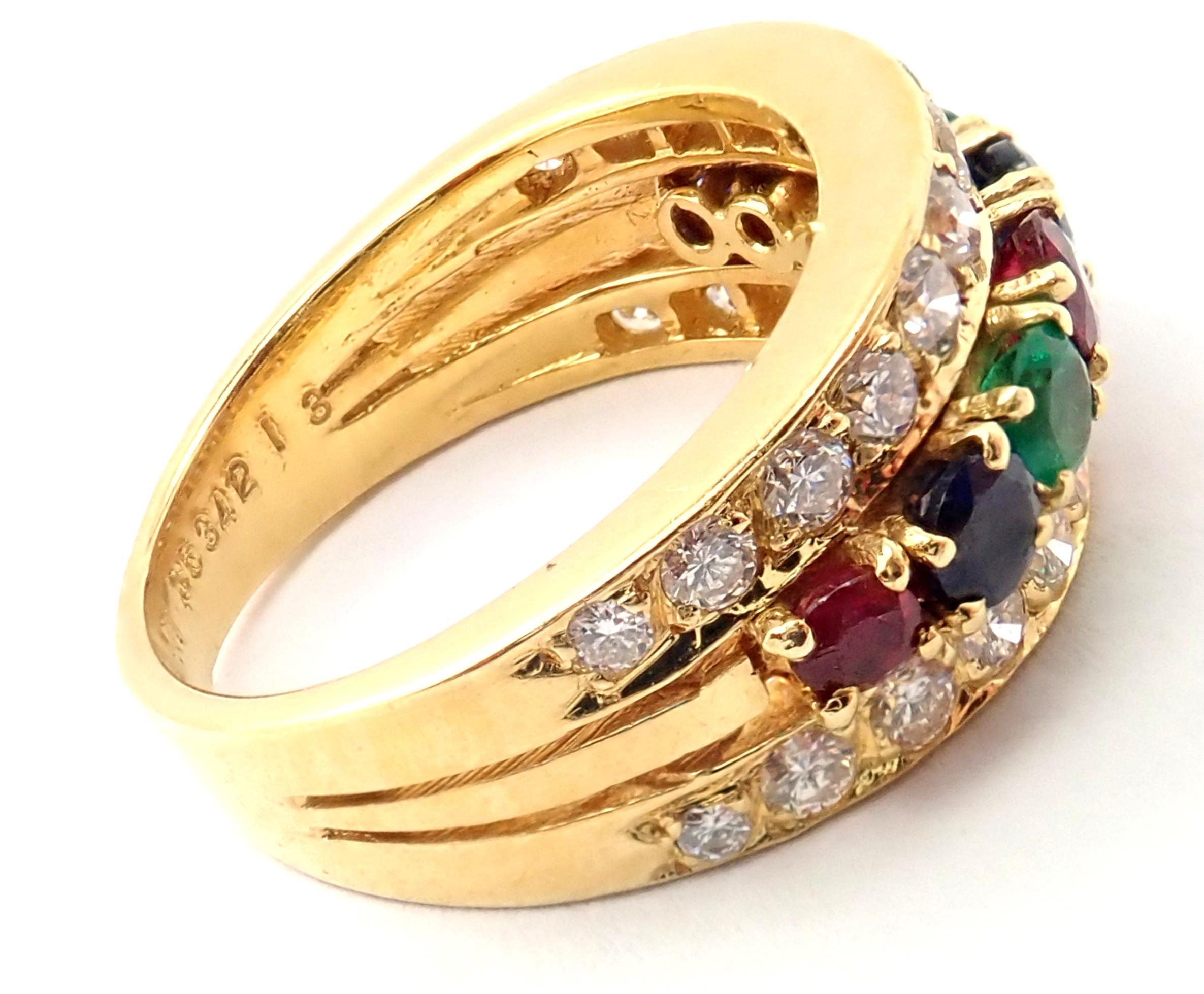 18k Yellow Gold Diamond, Ruby, and Sapphire, Emerald Band Ring by Van Cleef & Arpels. 
With 26 round brilliant cut diamonds, VS1 Clarity, G Color. Total Diamond Weight approx. .75ct. 
2 Round Emerald Stones
3 Round Ruby Stones
3 Round Sapphire