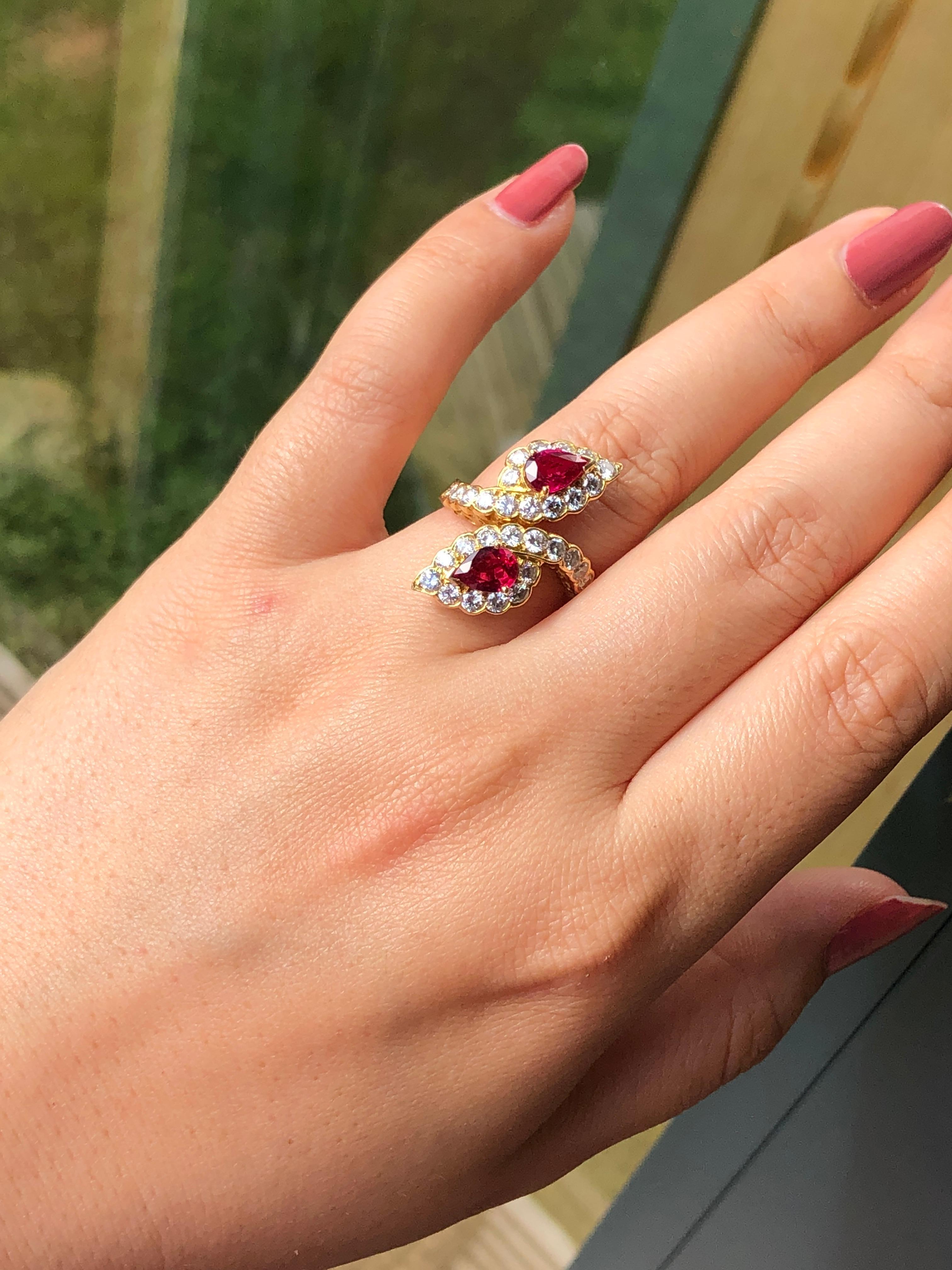 Vintage Van Cleef and Arpels 18 karat yellow gold cluster ring consisting of 2 pear shaped rubies weighing 2.3 carats in total. Very elegant design and so beautiful when you wear it. Signed Van Cleef and Arpels. Perfect condition.

Diamond : 1.2