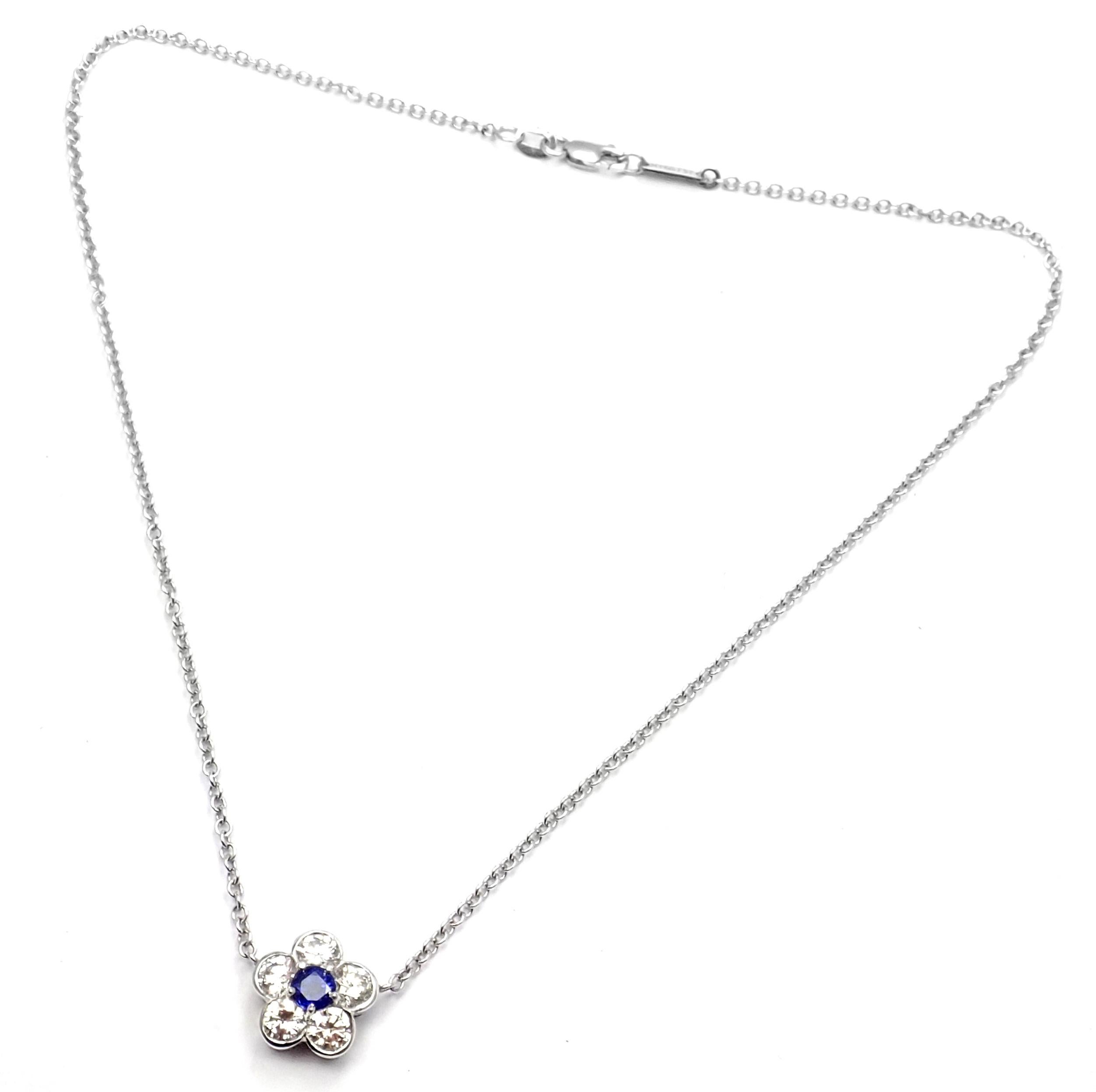 18k White Gold Diamond And Sapphire Fleurette Flower Pendant Necklace by Van Cleef & Arpels.
With 5 round brilliant cut diamond VVS1 clarity, E color total weight approx. 1.50ct
1 round sapphires total weight approx. .30ct
Details:
Length: