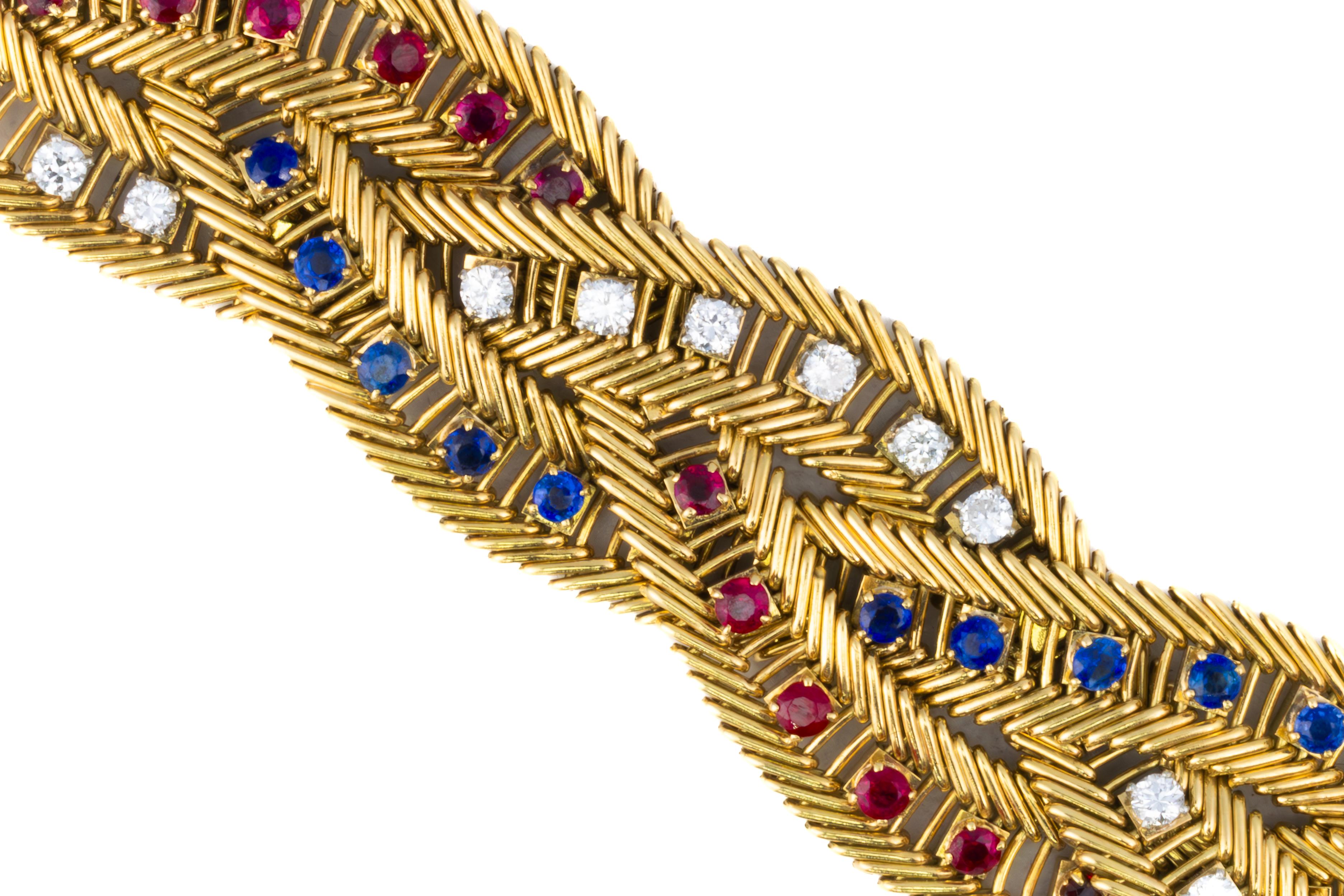Van Cleef & Arpels Diamond, Sapphire & Ruby Gold Rope Twist Bracelet

Description:
A striking Van Cleef & Arpels bracelet composed of intricately woven 18K yellow gold links forming a bold rope twist motif. Alternating channels of brilliant-cut
