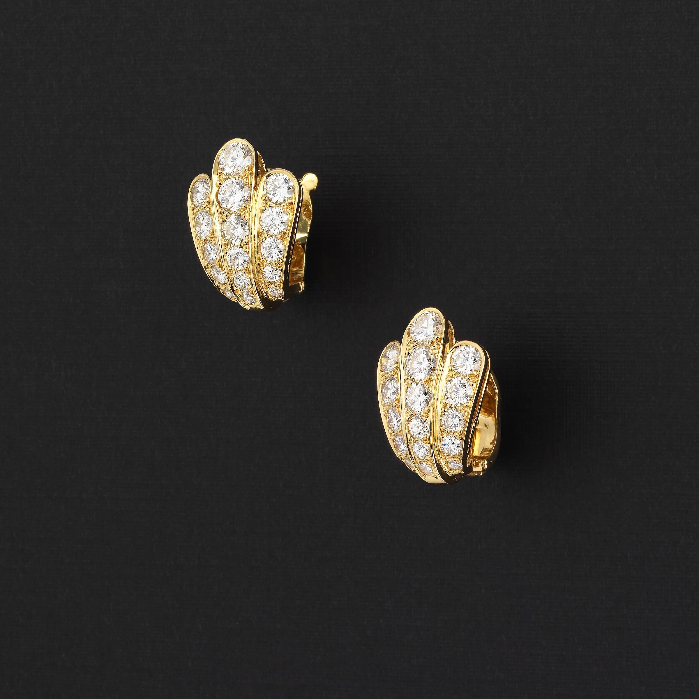 Van Cleef & Arpels dazzling vintage scallop shell-shape earrings showcasing approximately 3 carats of finest white diamonds and set in 18 karat yellow gold. The scallop shape gracefully fans out out from bottom to the top of the earrings and