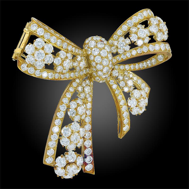 An 18k yellow gold flower motif snowflakes brooch, set with brilliant-cut diamonds, signed Van Cleef & Arpels. Circa 1980s. 

First, the most recognizable motif is the bow tie. Although bows have been part of Haute Couture fashion throughout many
