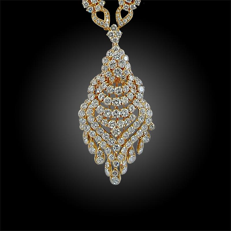 Exceptionally crafted by Van Cleef & Arpels in the 1980s, comprising a long chain diamond necklace crafted in 18k yellow gold, suspending a large tassel completely embellished with brilliant diamonds, with approximately 65 carats in its entirety.