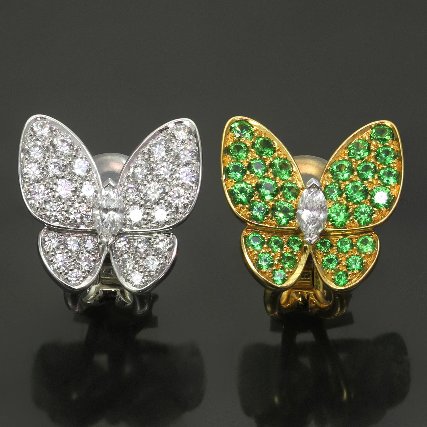 These magnificent Van Cleef & Arpels clip-on earrings feature an elegant butterfly design with one earring crafted in 18k yellow gold and set with green tsavorite stones weighing an estimated 1.0 carats and another earring made in 18k white gold and