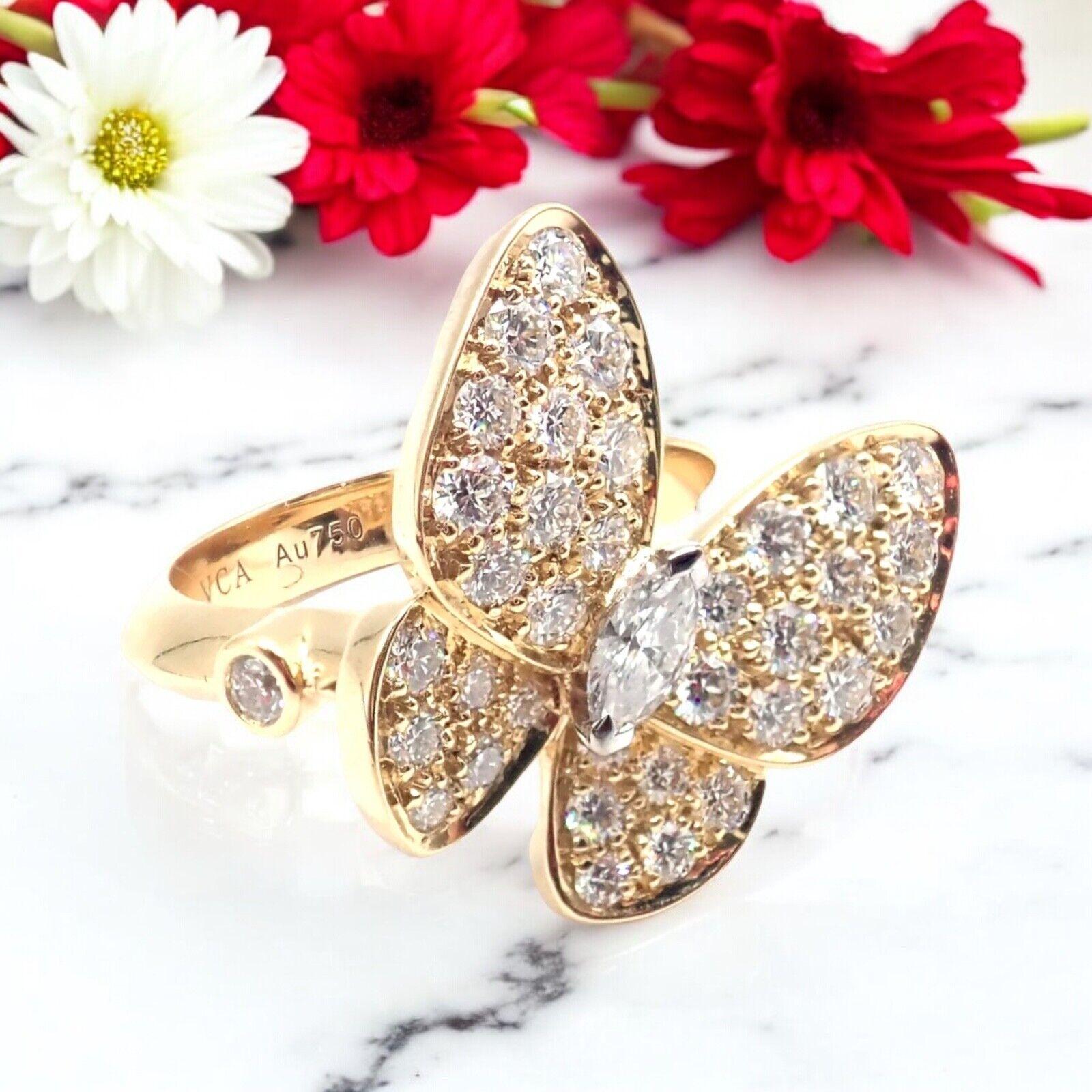 18k Yellow Gold Diamond Two Butterfly Ring by Van Cleef & Arpels.
The Authentic Van Cleef & Arpels 18k Yellow Gold Diamond Two Butterfly Ring is a luxurious piece, showcasing two delicate butterflies crafted from 18k yellow gold. 
The butterflies