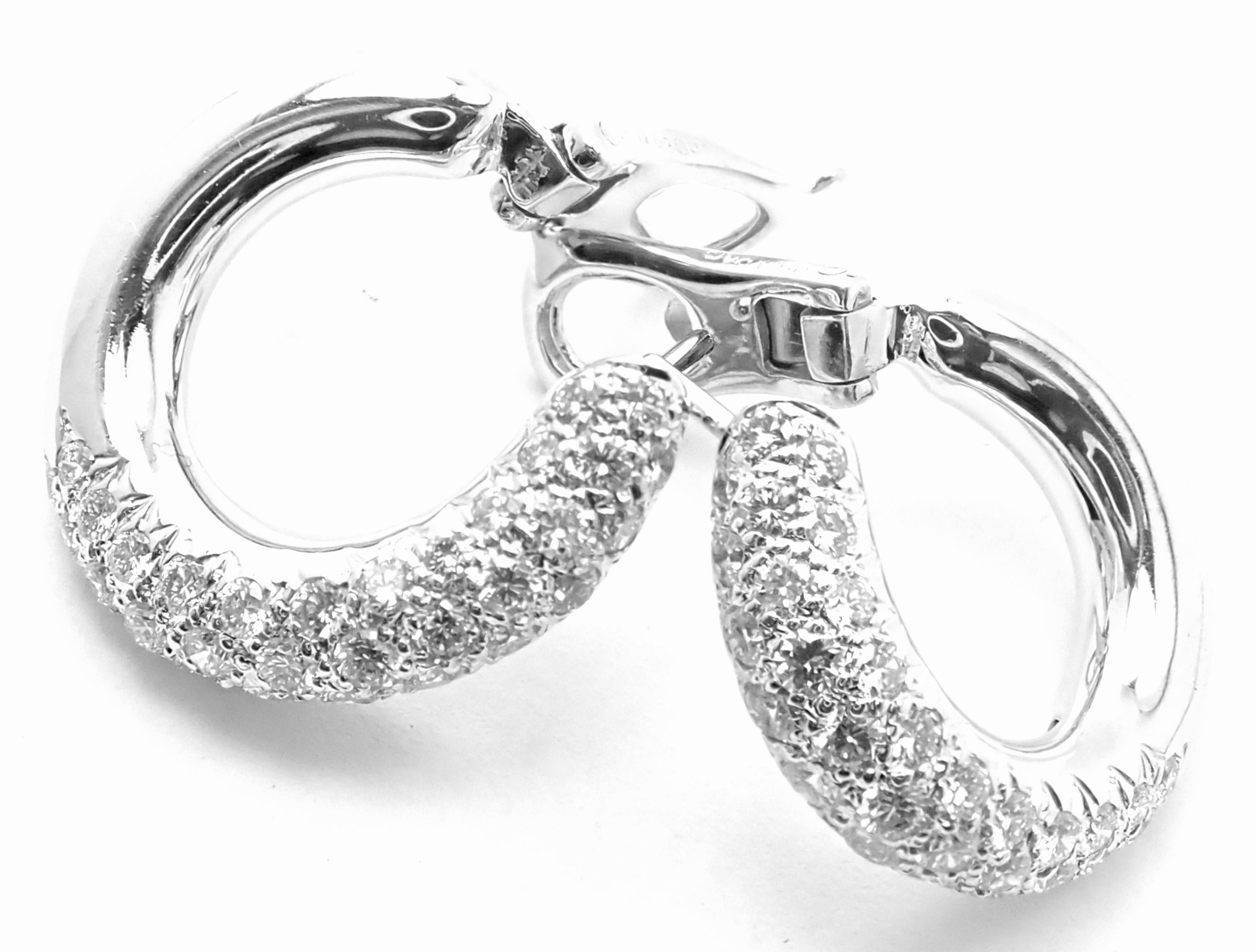 18k White Gold Diamond Hoop Earrings by Van Cleef & Arpels. 
With 68 round brilliant cut diamonds VVS1 clarity, E color total weight approx. 1.70ct
These earrings are for pierced ears.
These earrings come with Van Cleef & Arpels box and a service