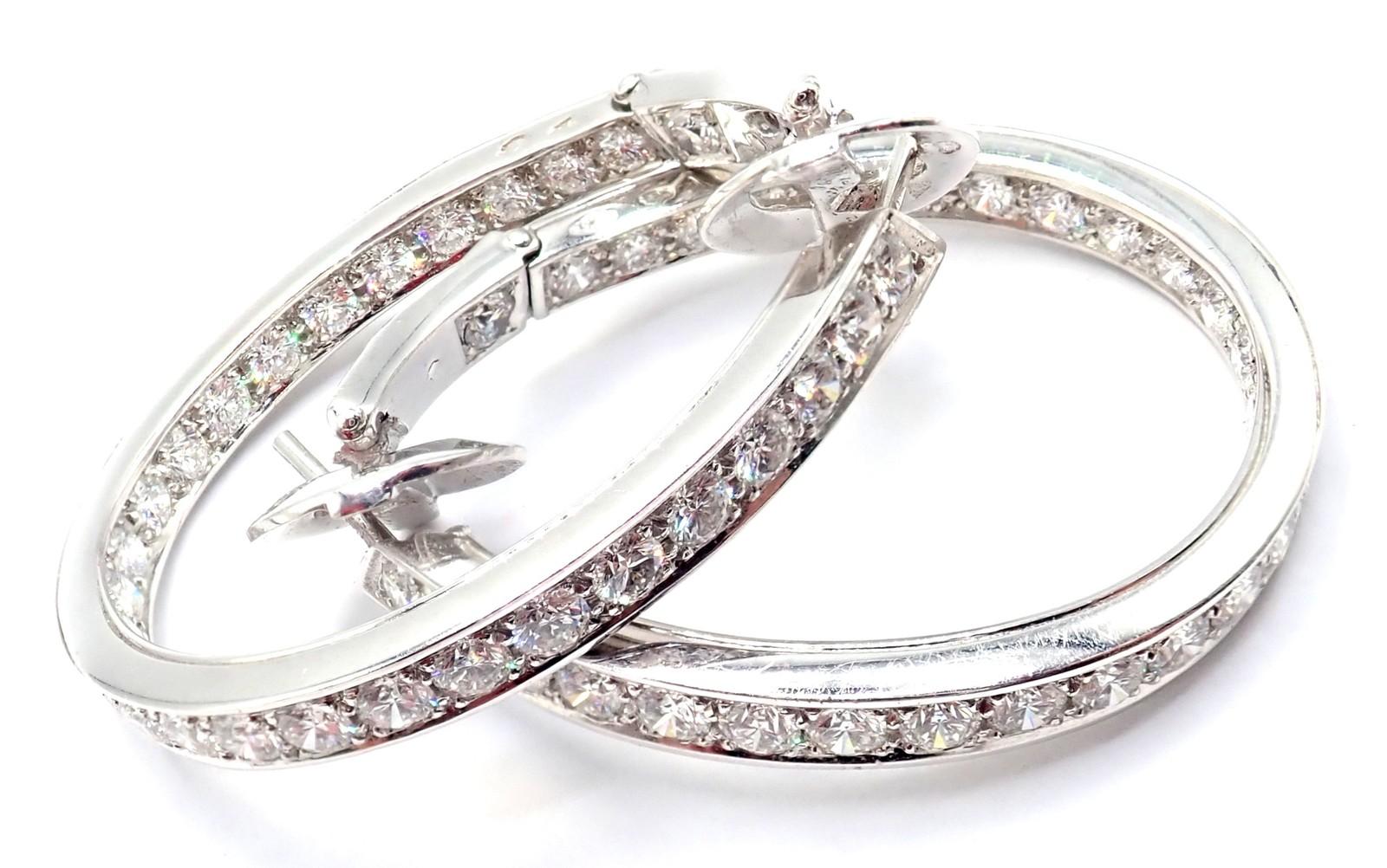 18k White Gold Diamond Large Hoop Earrings by Van Cleef & Arpels. 
With 60 round brilliant cut diamonds VVS1 clarity, E color total weight approximately 5.5ct
These Van Cleef & Arpels large hoop earrings are exquisitely crafted in 18k white gold and