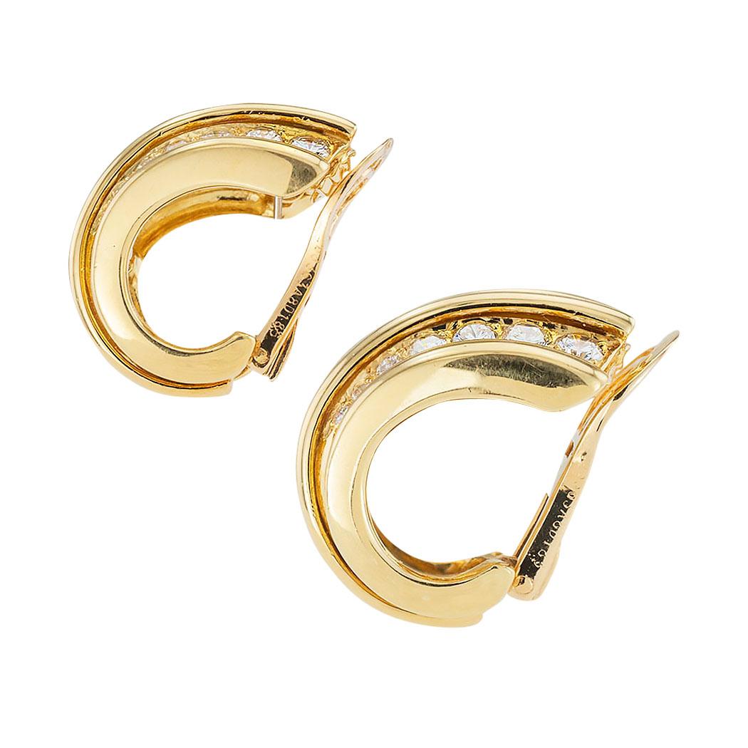 Van Cleef & Arpels diamond and yellow gold half hoop clip on earrings circa 1980.  Love them because they caught your eye and we are here to connect you with beautiful Van Cleef earrings.  Make yourself happy!  Simple and concise information you