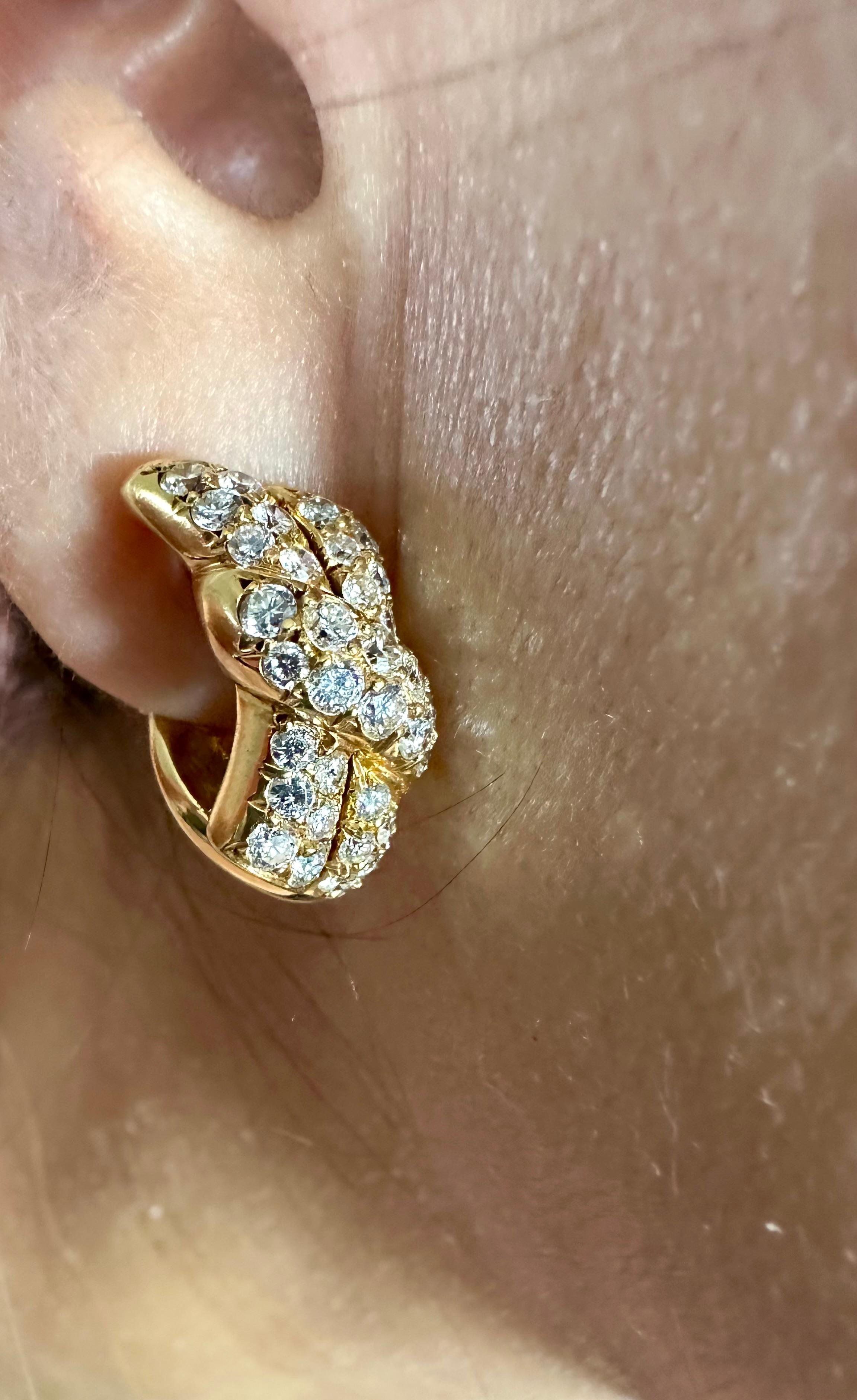 Van Cleef & Arpels Elegant Ribbon Motif Diamond Pave Set Earrings
Est. 2.50 cts total Diamonds
D VVS 
Made In France 
1970's Workshop Hallmarks vca ny3K607.19
10 mm width x 18mm length

Van Cleef & Arpels’ Alhambra jewelry is an iconic collection