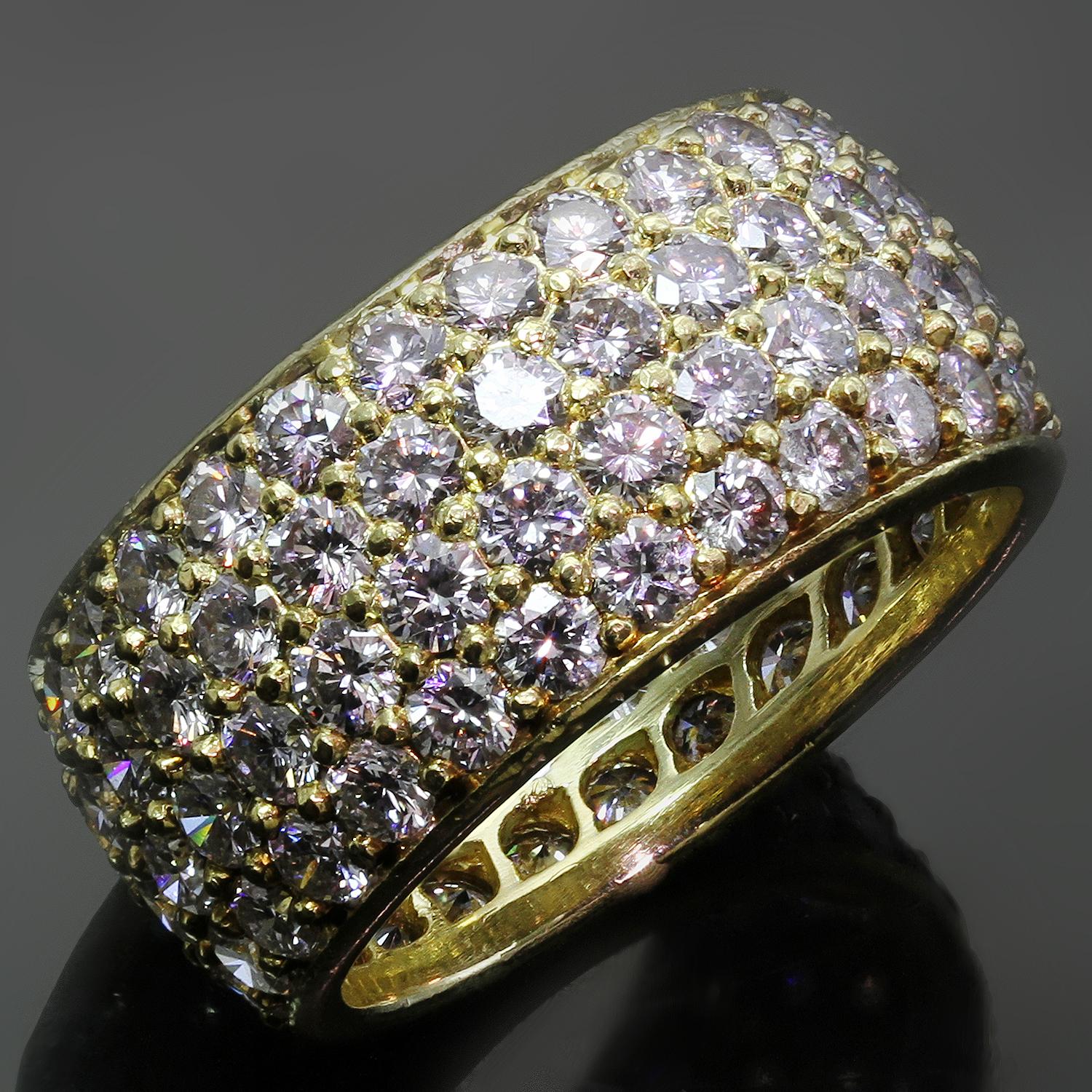 This classic vintage Van Cleef & Arpels wide eternity band is crafted in 18k yellow gold and pave-set with round brilliant D-F VVS1-VVS2 diamonds weighing an estimated 5.10-5.25 carats. Made in France circa 1980s. Measurements: 0.35