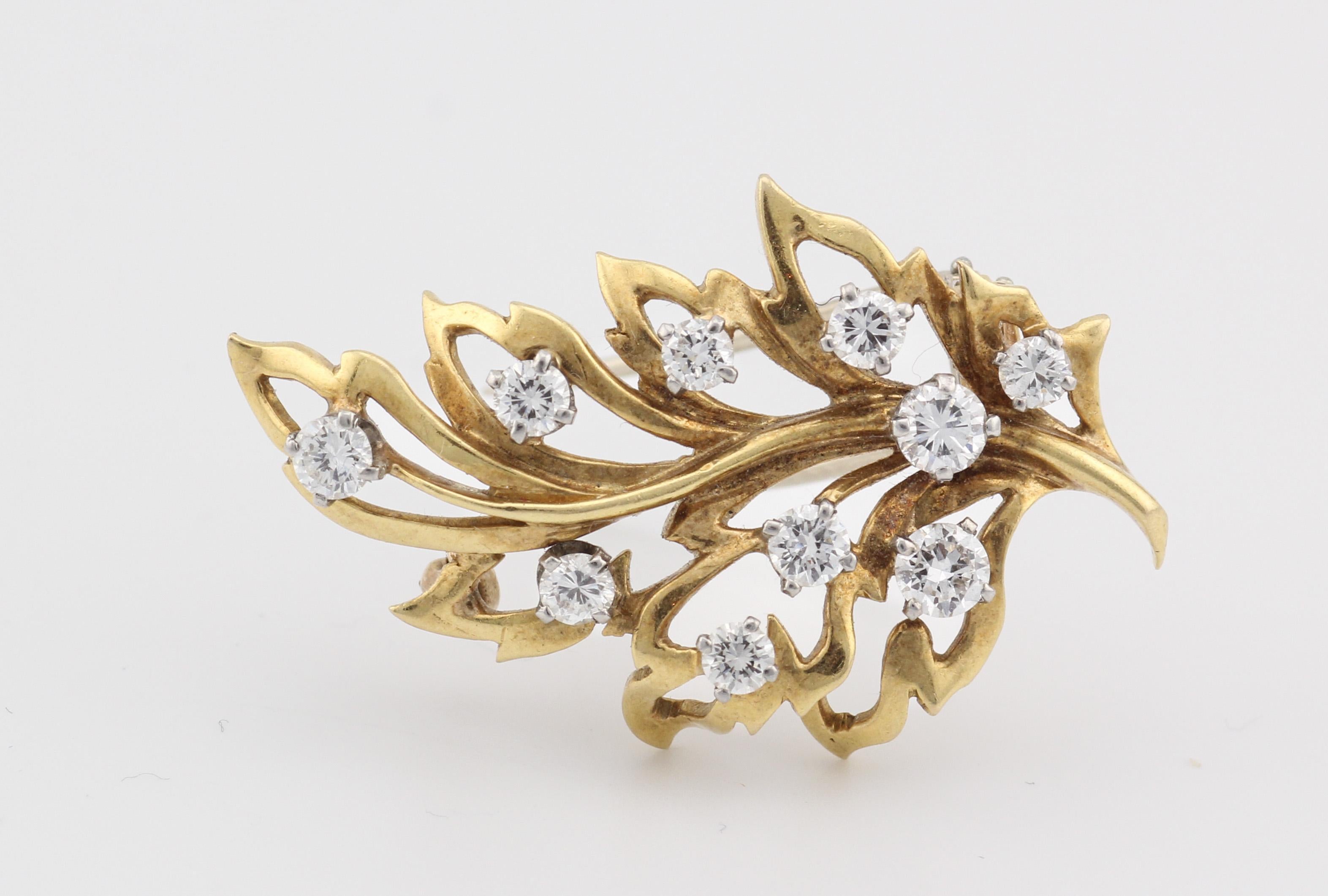 The Van Cleef & Arpels Diamond 18K Yellow Gold Leaf Brooch is a masterpiece of craftsmanship and elegance, showcasing the renowned sophistication of the esteemed jewelry house. Crafted from luxurious 18K yellow gold, this brooch features a