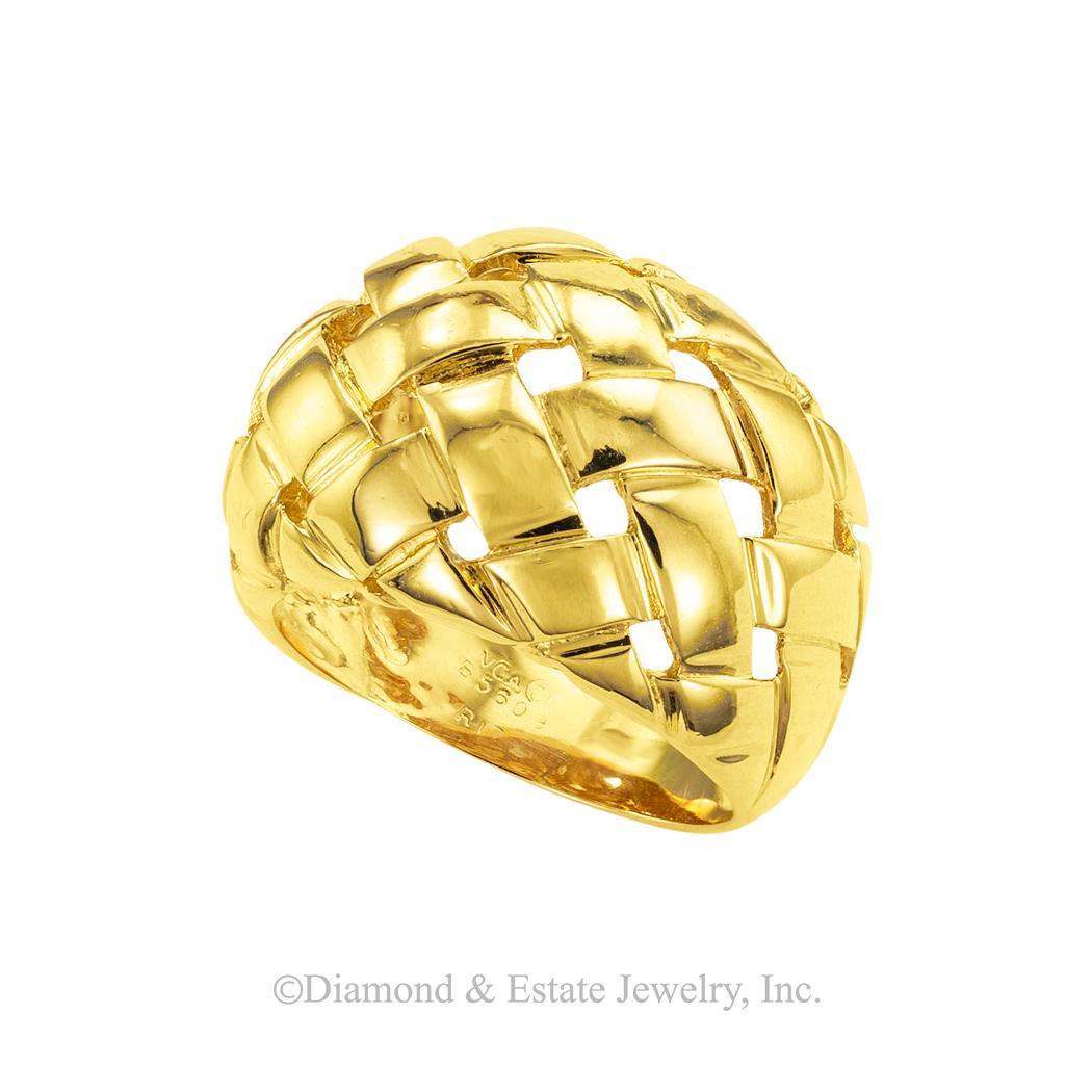 Van Cleef & Arpels domed gold ring circa 1980. *

ABOUT THIS ITEM:  #A8060. Scroll down for specifications.  The wide band is slightly domed with a basket weave motif accented by a bright polished gold finish.

SPECIFICATIONS: 

METAL:  18-karat