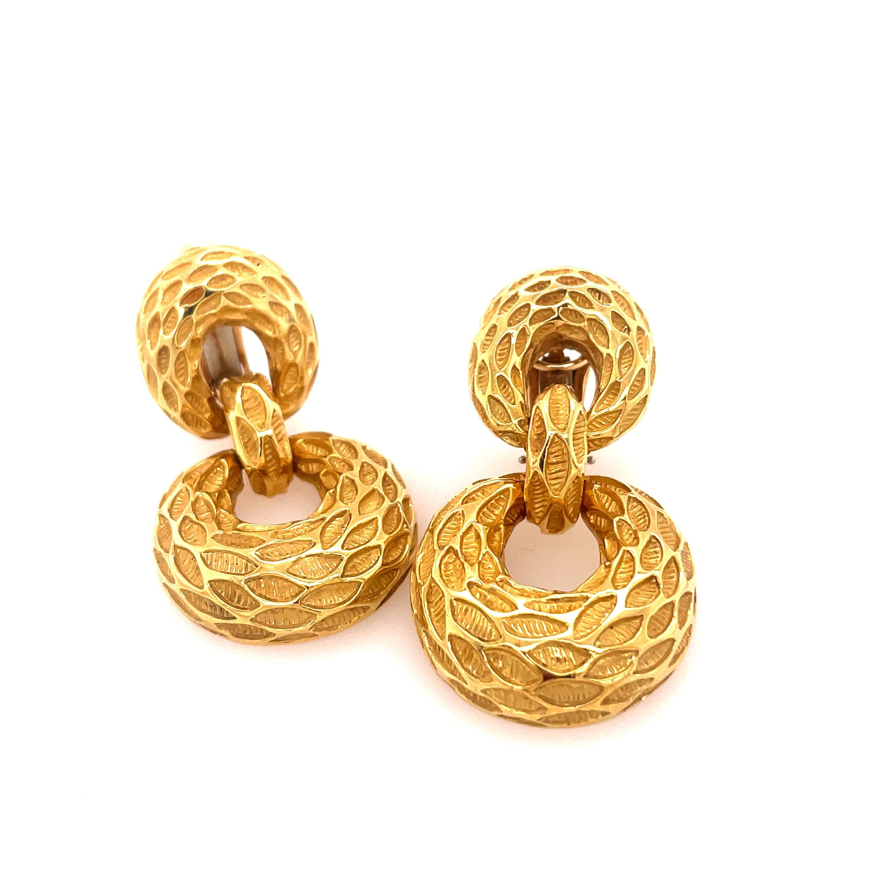 Van Cleef and Arpels 18kt hammered yellow gold door knocker earrings with great movement. Stamped 18k with VCA signature and numbering.
30dwt