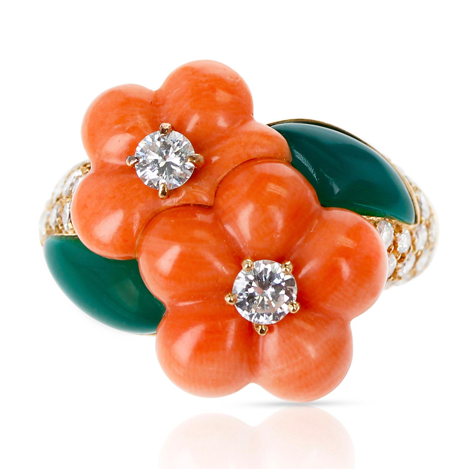 A Van Cleef & Arpels Double Flower Coral, Chrysoprase, and Diamond Ring. The appx. total diamond weight is 0.96 carats, and the color is appx. F and the clarity is appx. VVS1. Total Weight: 12 grams. Ring Size 6.50. 
