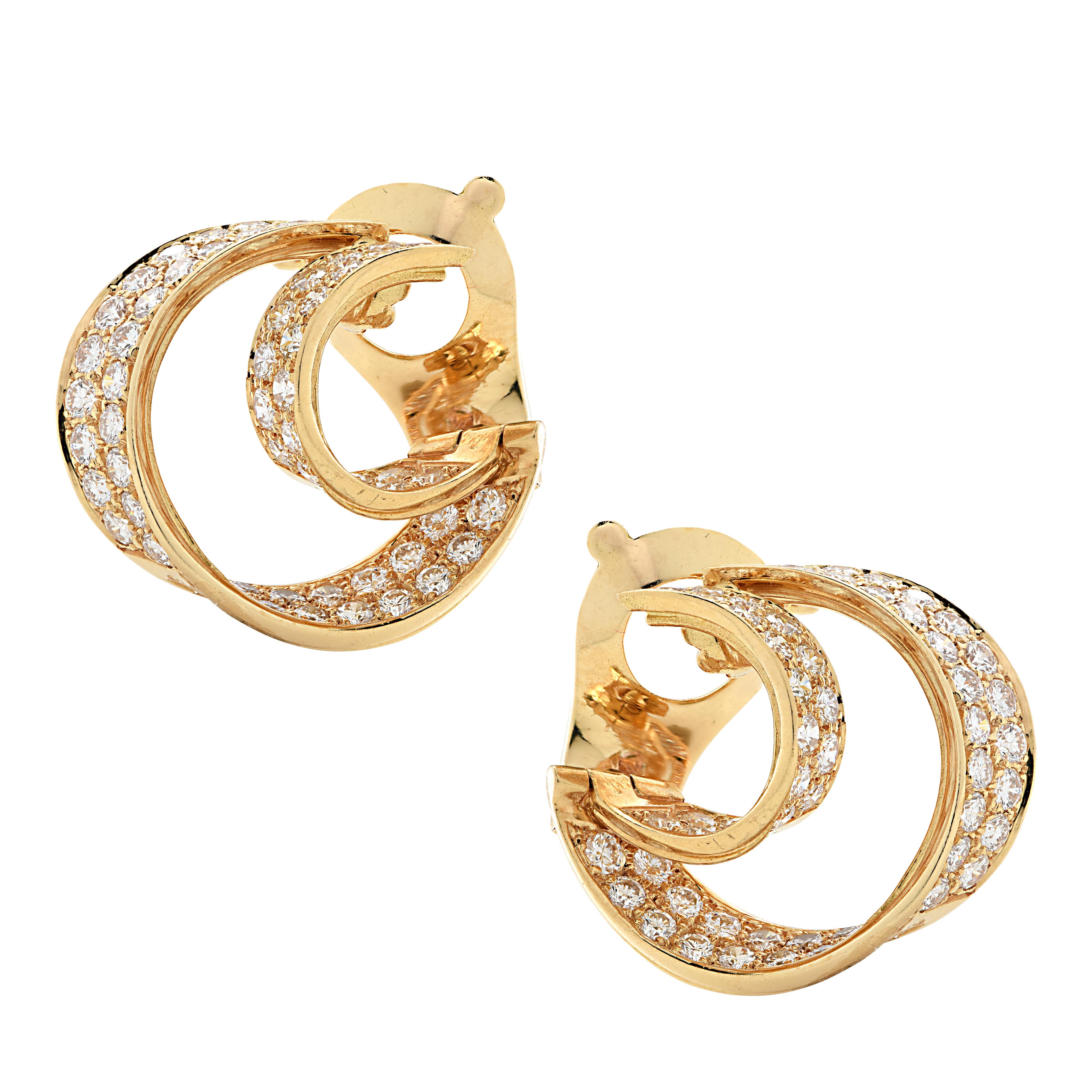 From the legendary House of Van Cleef & Arpels, these exquisite double hoop clip-on earrings, finely handmade in 18 Karat Yellow Gold, showcase 114 round brilliant cut diamonds weighing approximately 5.70 carats total, D-F color, VVS-VS clarity.