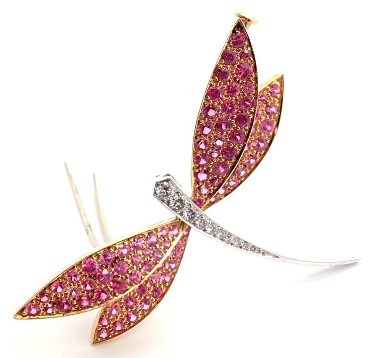 18k White Gold Diamond Pink Sapphire Dragonfly Brooch Pin by Van Cleef & Arpels. 
With 9 round brilliant cut diamonds VVS1 clarity, E color 
82 round pink sapphires
Details: 
Weight: 7.5 grams
Measurements: 45mm x 40mm
Stamped Hallmarks: Van Cleef &