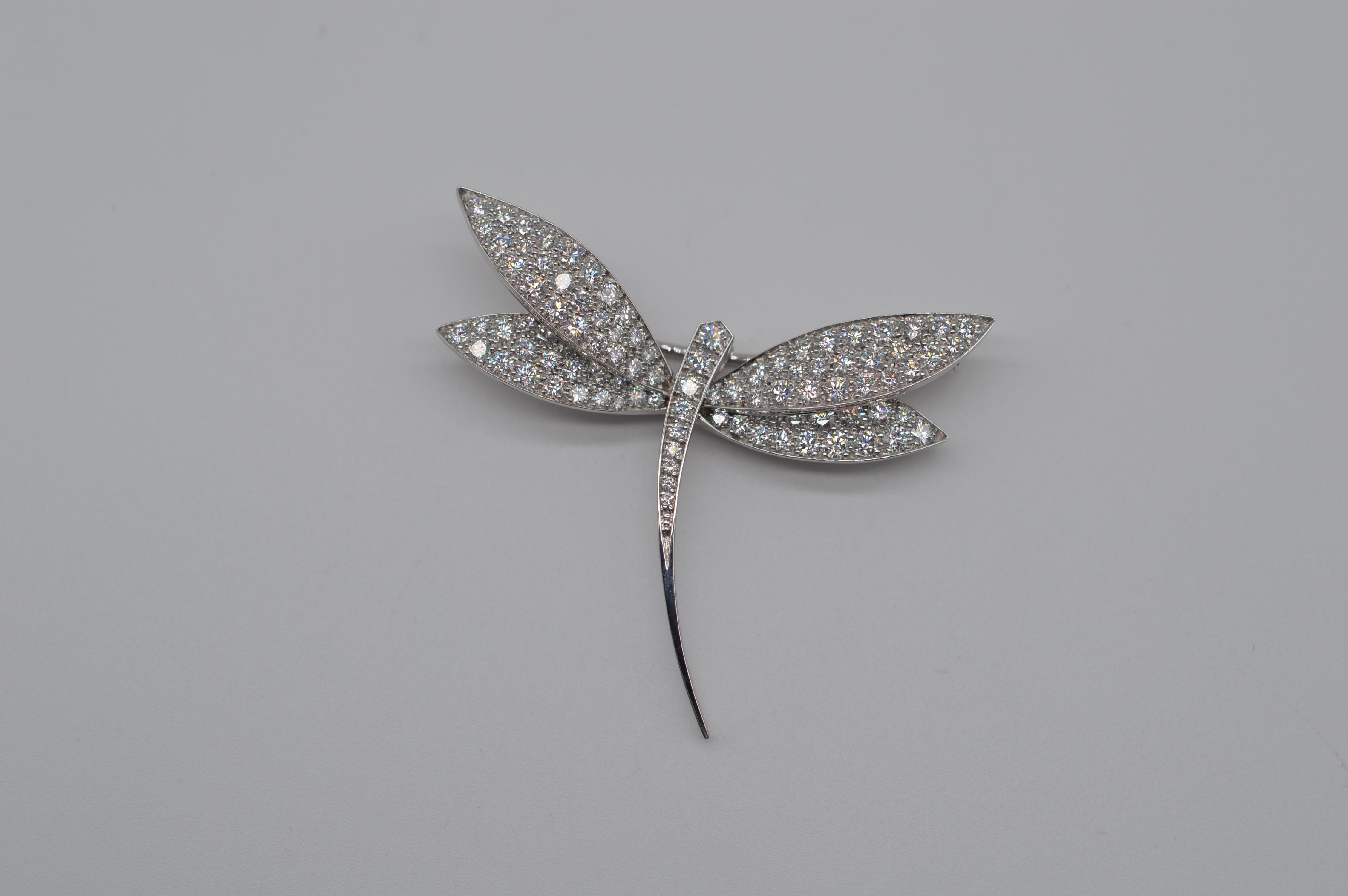 Van Cleef & Arpels Dragonfly Diamonds Brooch Unworn
18K White Gold
Weight 7.8 grams 
Diamonds Setting 
Set with 101 Round Diamonds for an approximative weight of 2.55 carats (Color F-G / Clarity VVS1-2)
Comes with original box
From 2000