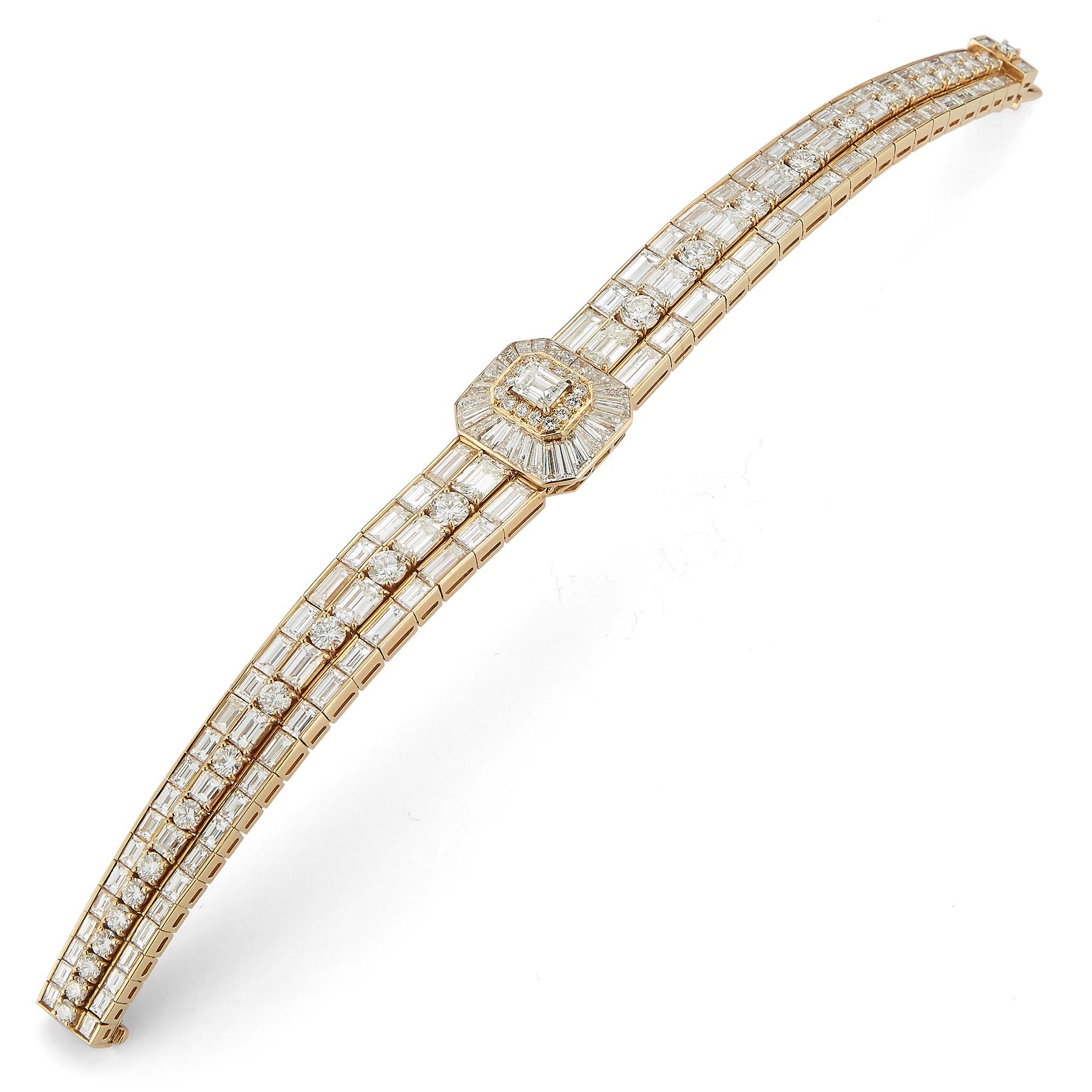 Van Cleef & Arpels Emerald Cut Diamond Bracelet, emerald, tapered baguettes & round cut diamonds set in 18k yellow gold.

Approximately 46 carats of diamonds

Measurements: 7