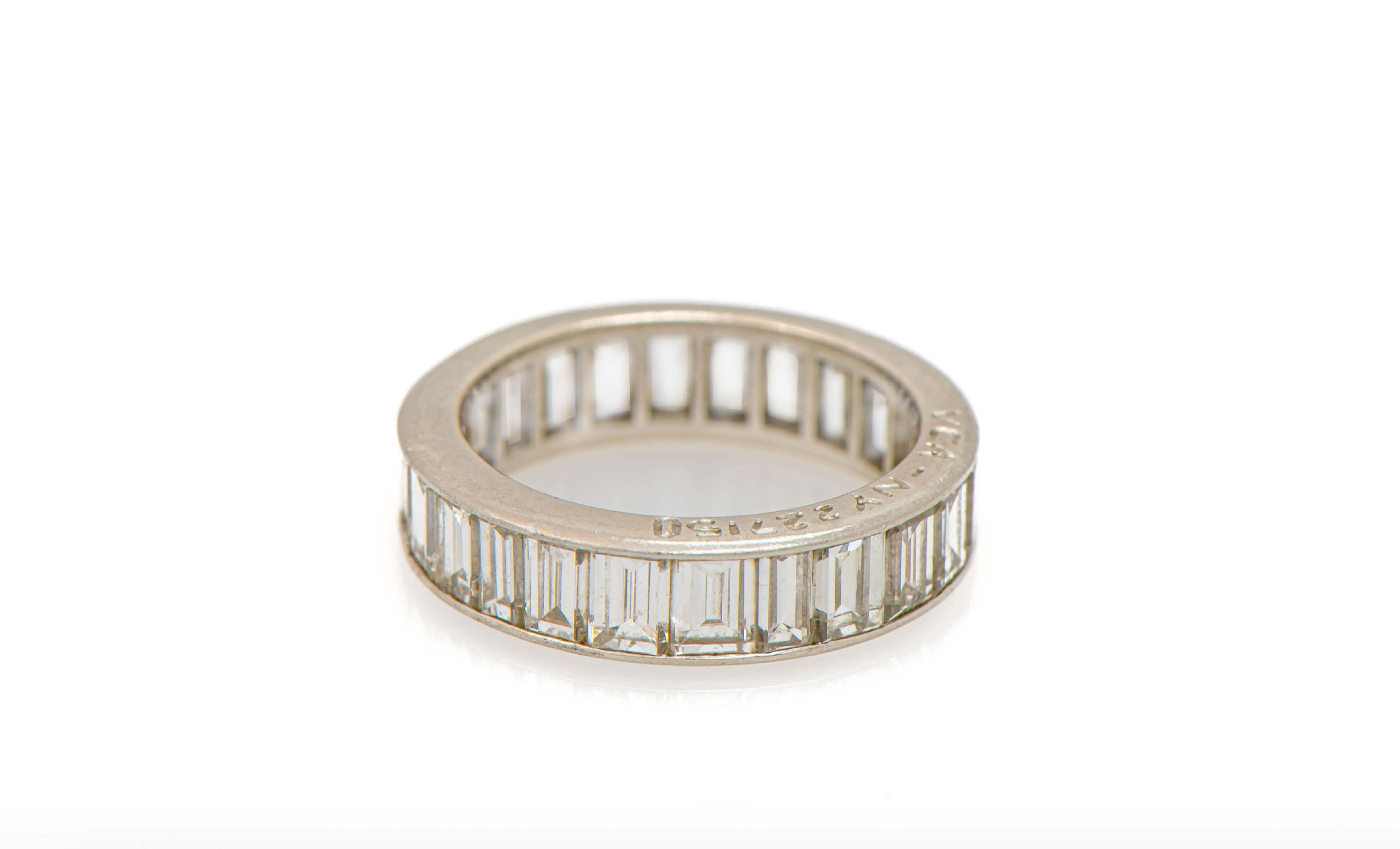 Van Cleef & Arpels Emerald Cut Diamond Eternity Band, 

24 emerald cut diamonds set in platinum. 

Total Approximate Diamond Weight: 3.39 carats

Ring Size: 4.75

Signed VCA NY & numbered 