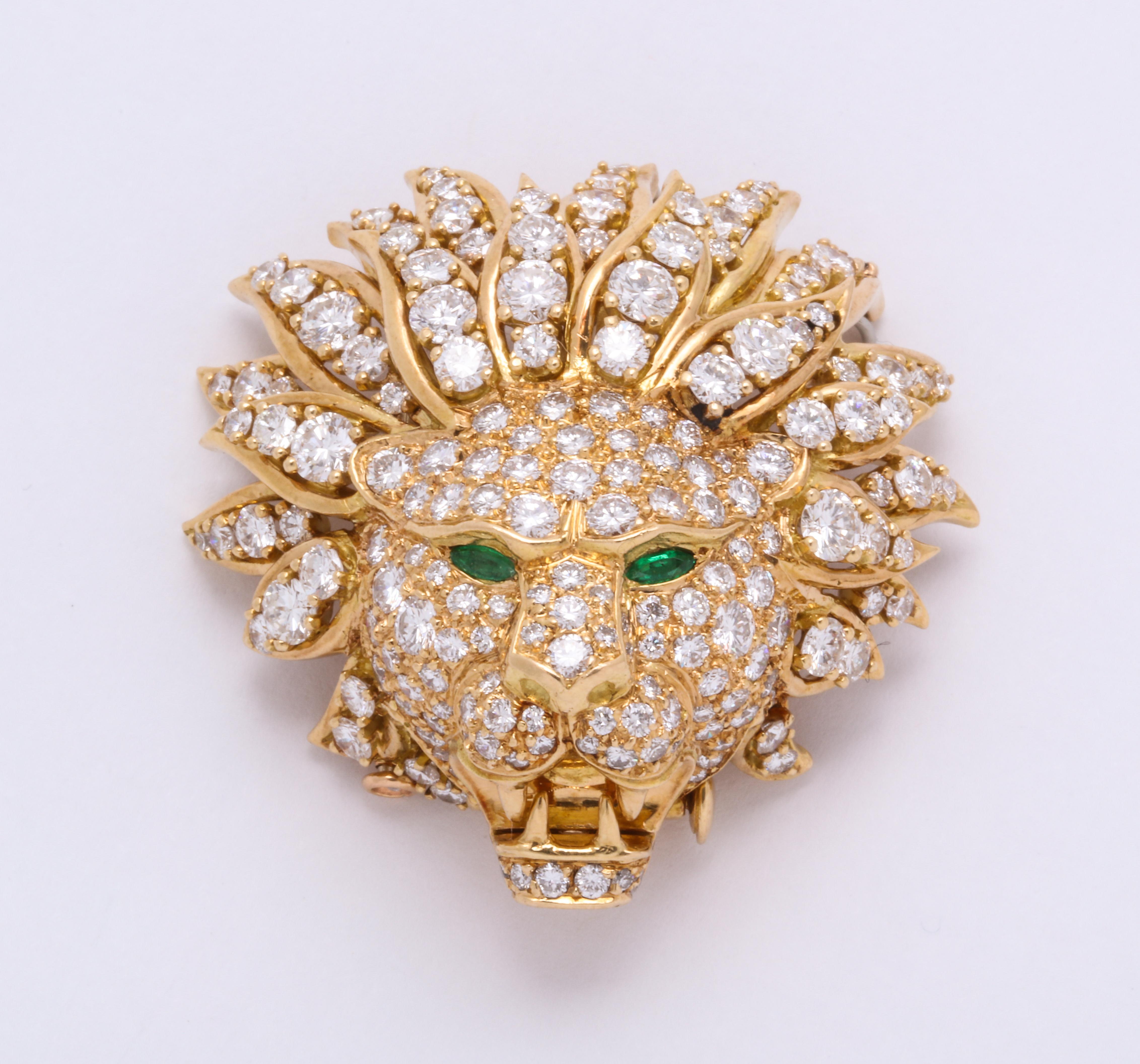 Round diamonds and marquise emeralds are expertly combined by Van Cleef & Arpels to make the fanciest king of the beasts.  Made in France for VCA's New York boutique, this piece can be hung from a necklace to be worn as a pendant or pinned on a