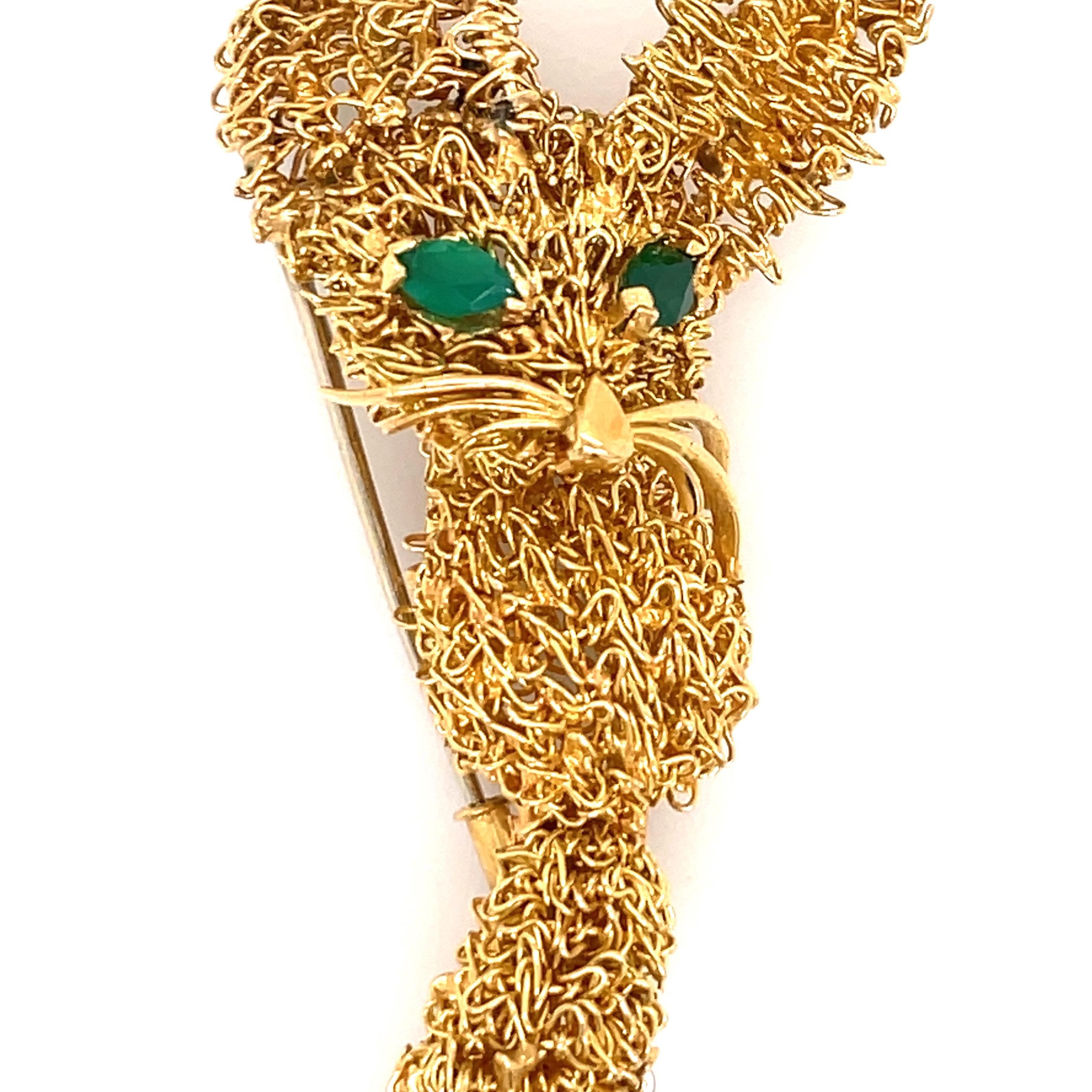 Stamped VAN CLEEF & ARPELS, this fennec has a gold wire body decorated with cabochon emeralds eyes.
Signed Van Cleef & Arpels, numbered, French assay mark for gold.
Measurements:
Length: 2.75 Inches
Width of Head 1.13 Inches
Body 0.50 Inches
Bottom